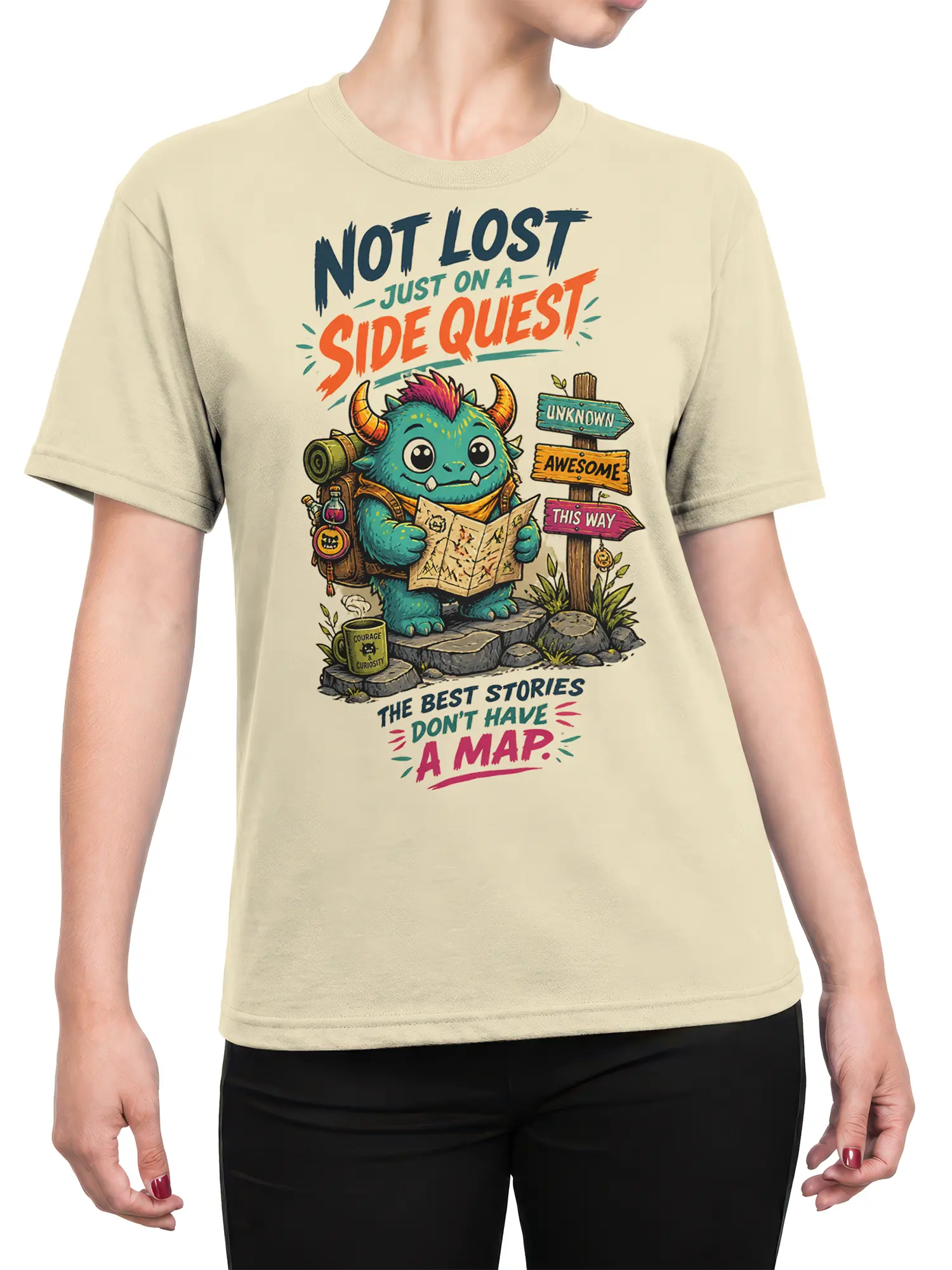 Female torso wearing a beige fantasy T-shirt with a horned creature, map, backpack, and side quest artwork