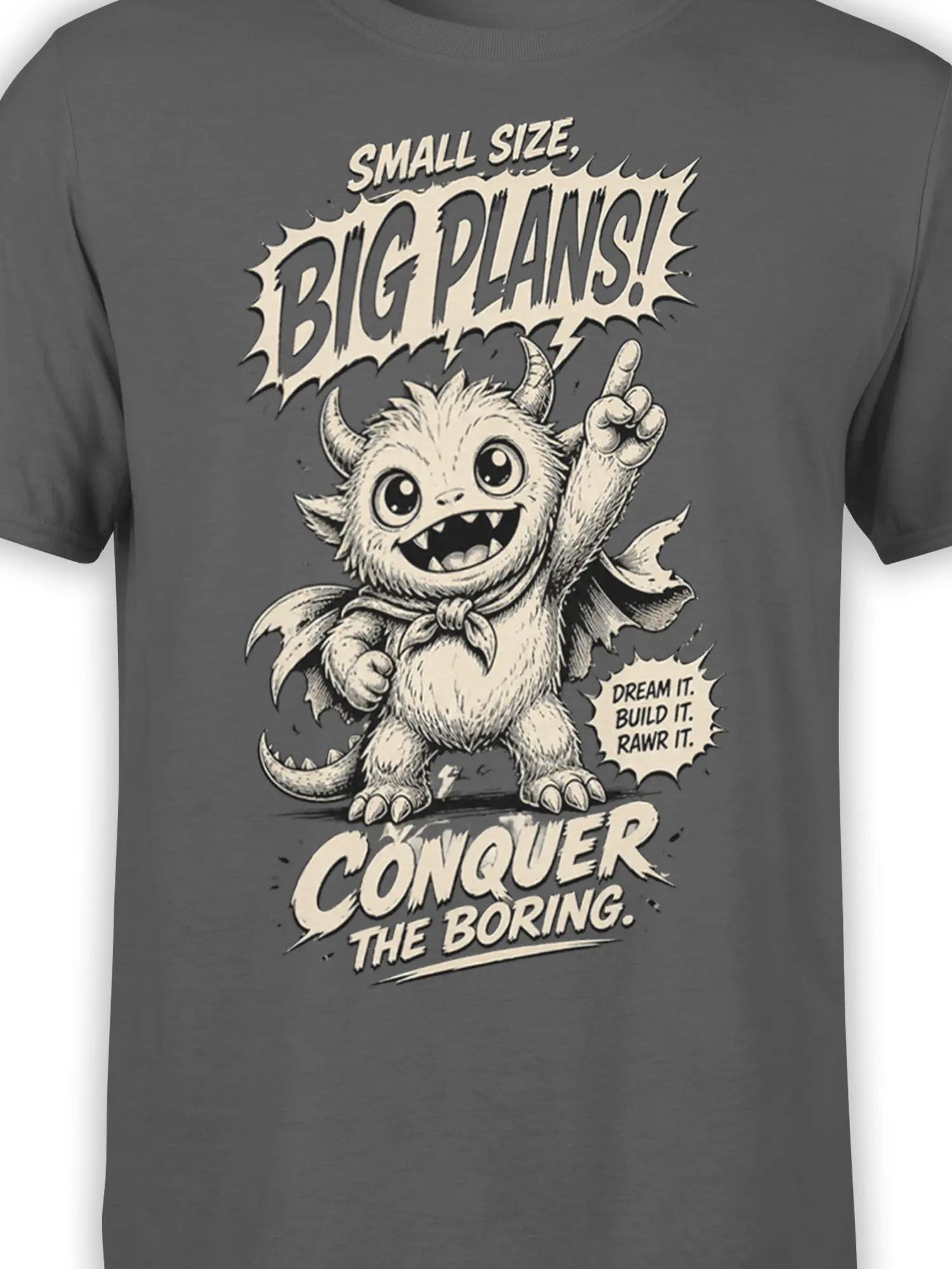 Close-up of cute winged monster graphic and motivational “Small Size, Big Plans” text on gray shirt