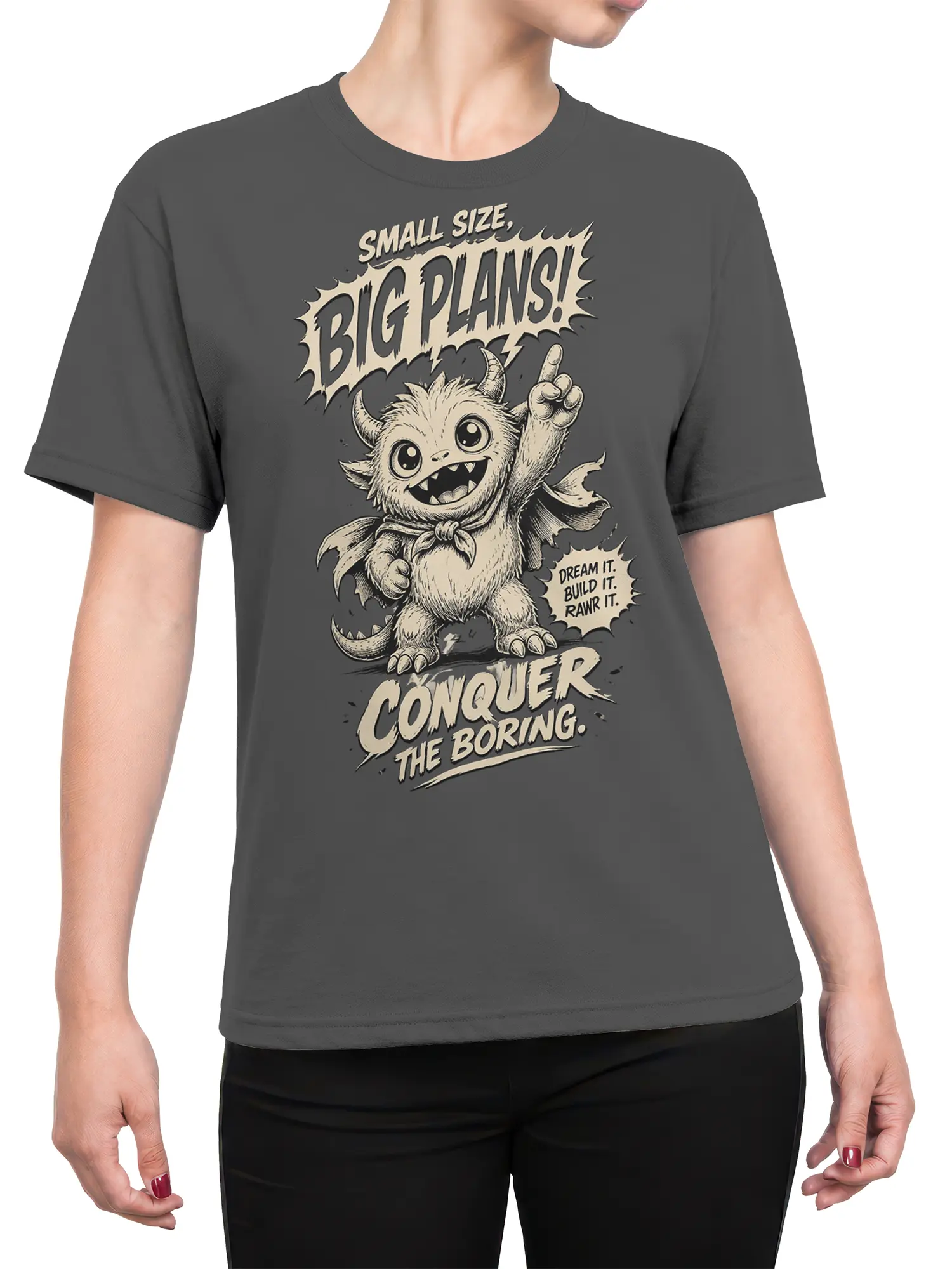 Female torso wearing gray T-shirt with cute horned monster and “Conquer the Boring” graphic
