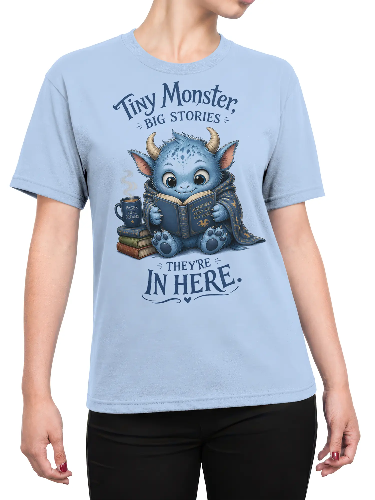 Female torso wearing a light blue T-shirt with a blue monster reading among books
