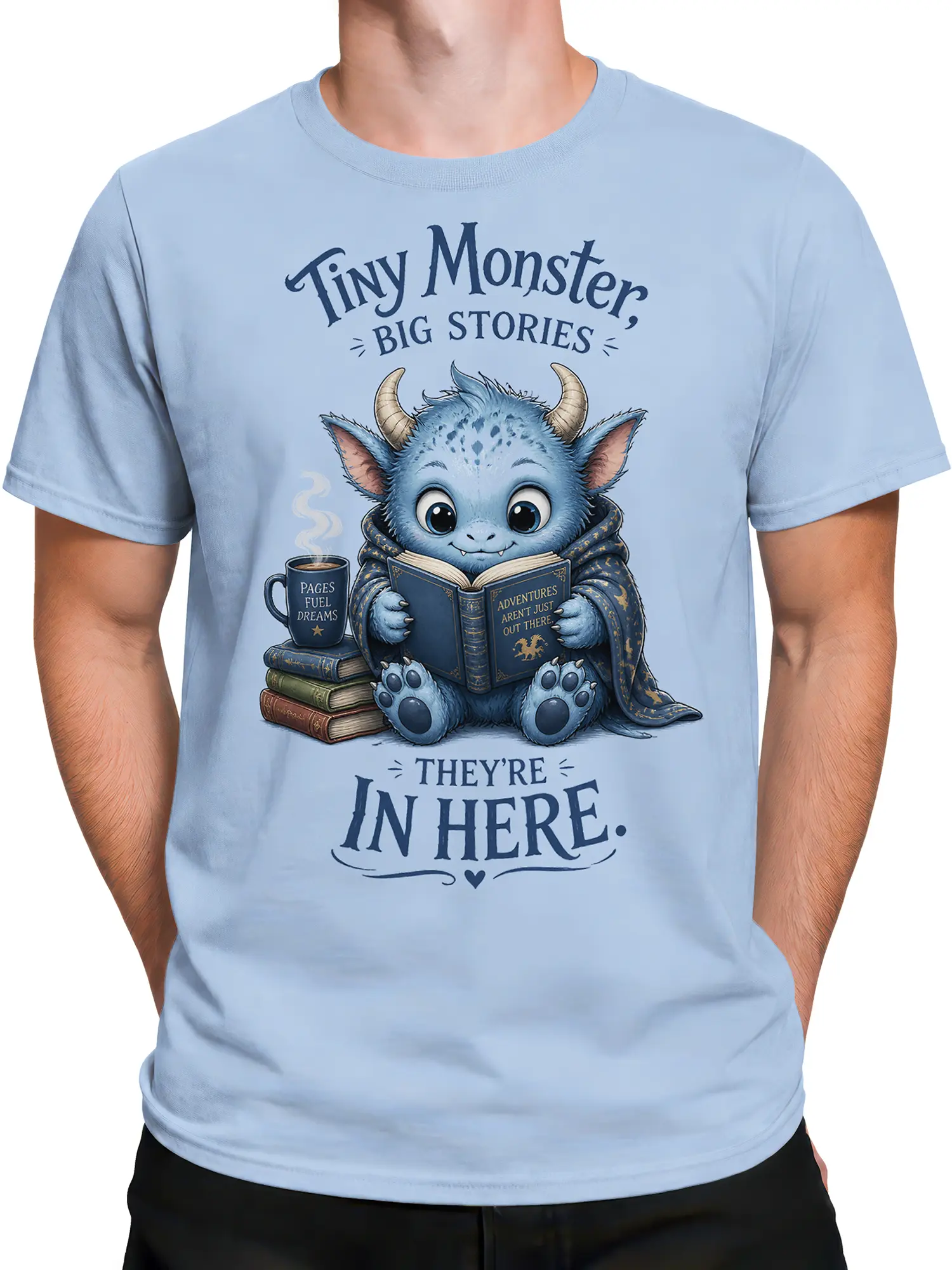 Male torso wearing a light blue fantasy T-shirt with a horned monster reading