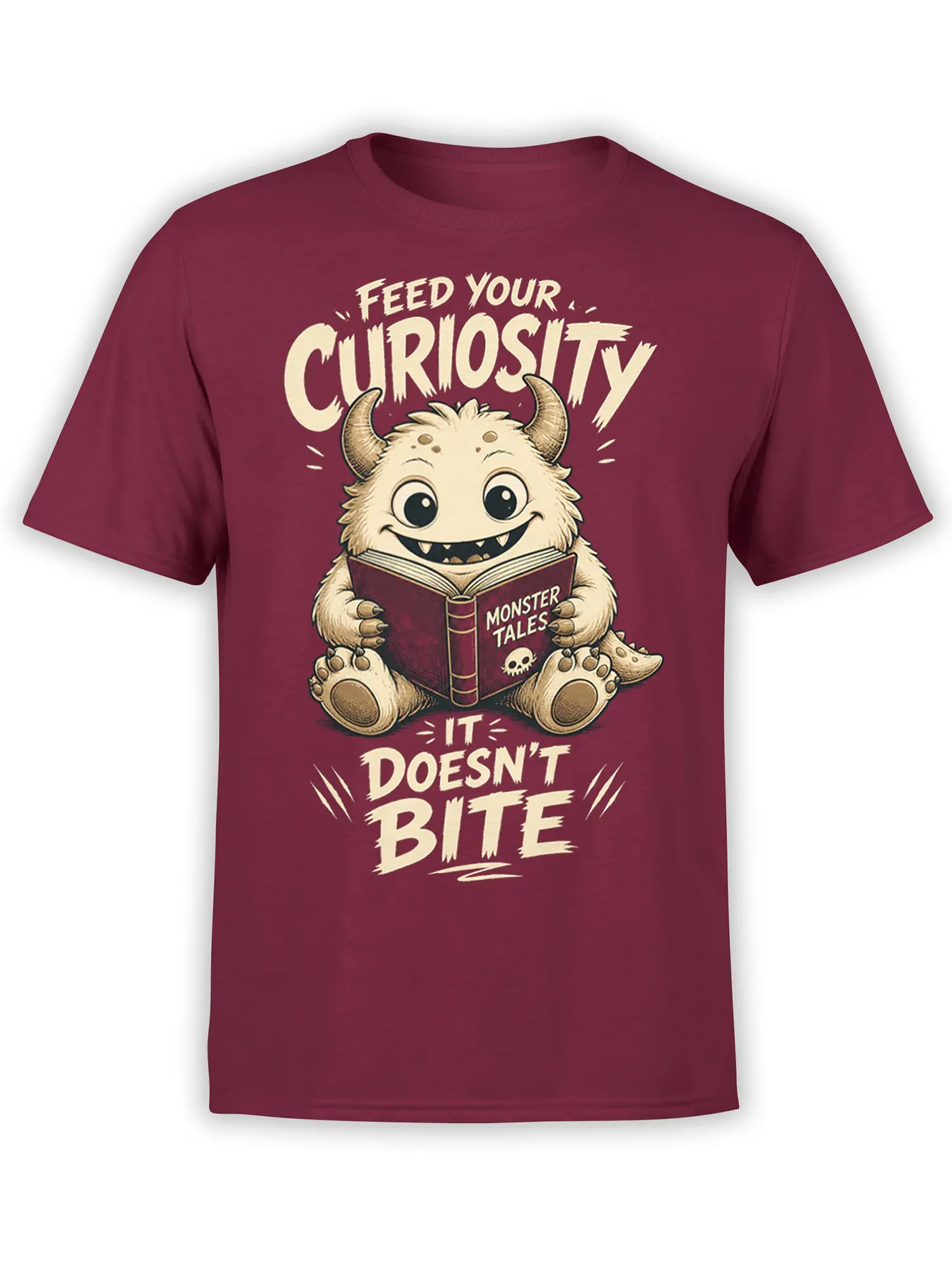 Whimsical horned monster reading a book on a burgundy T-shirt with “Feed Your Curiosity” lettering