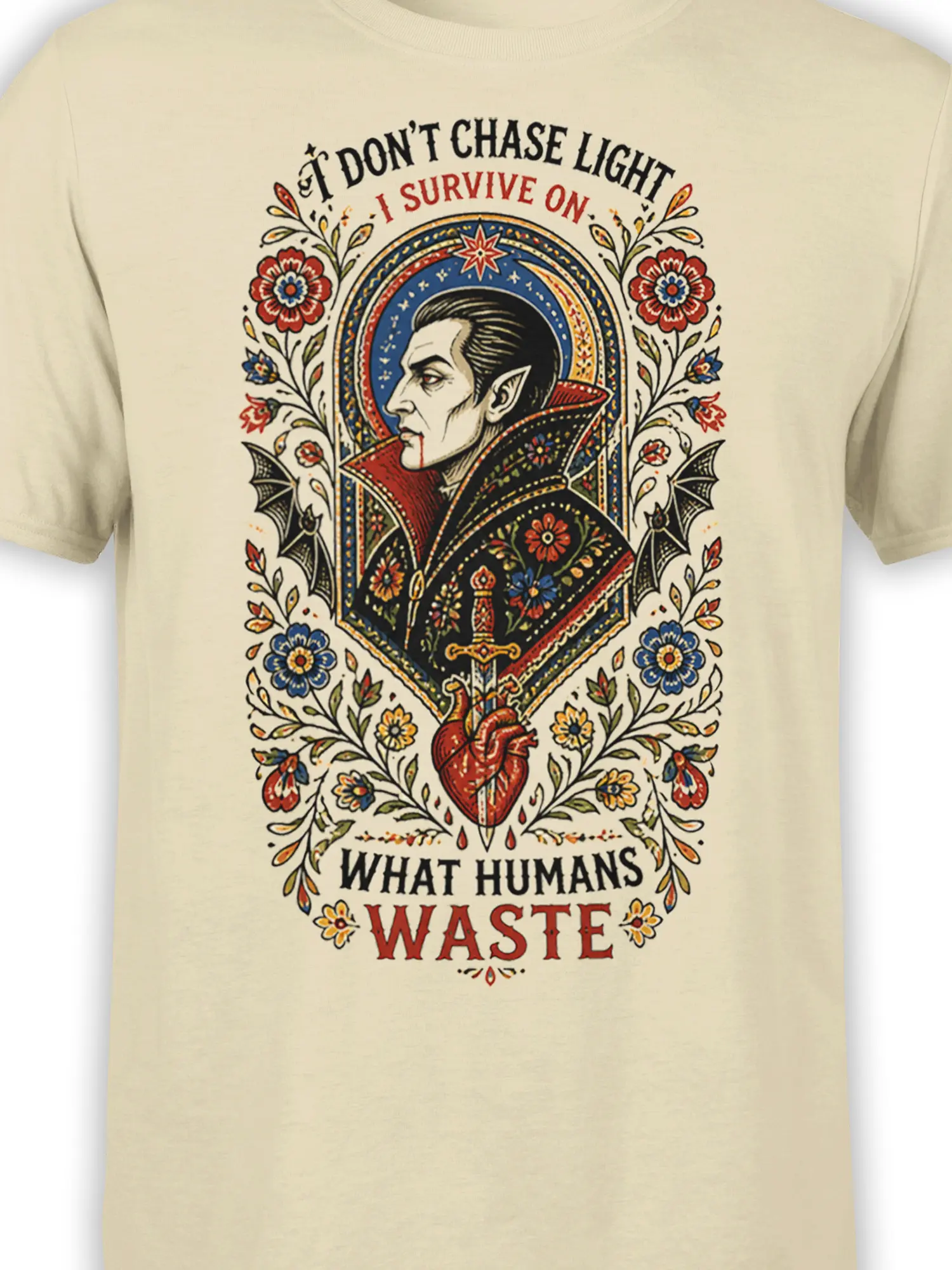 Close-up of beige T-shirt artwork showing a vampire portrait, floral details, bats, sword, heart, and gothic text