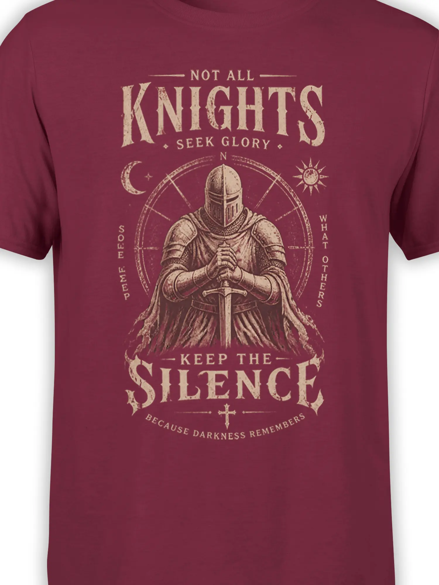 Close-up of burgundy knight graphic with sword, moon, sun, stars, and distressed medieval lettering