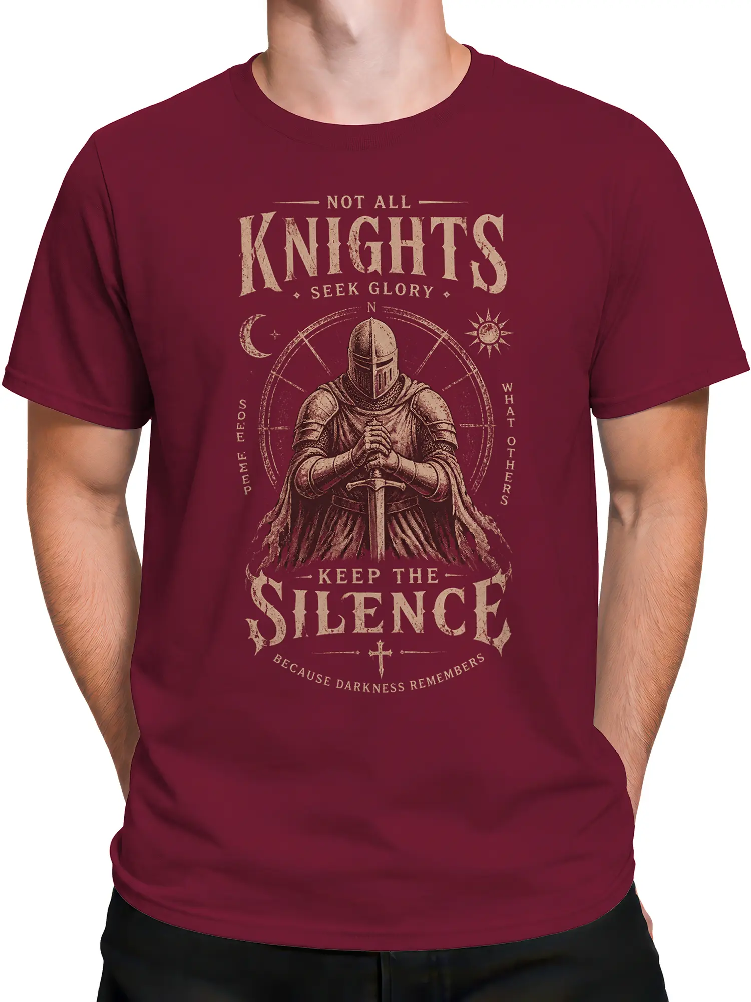 Male torso wearing burgundy knight T-shirt with vintage sword and dark medieval message
