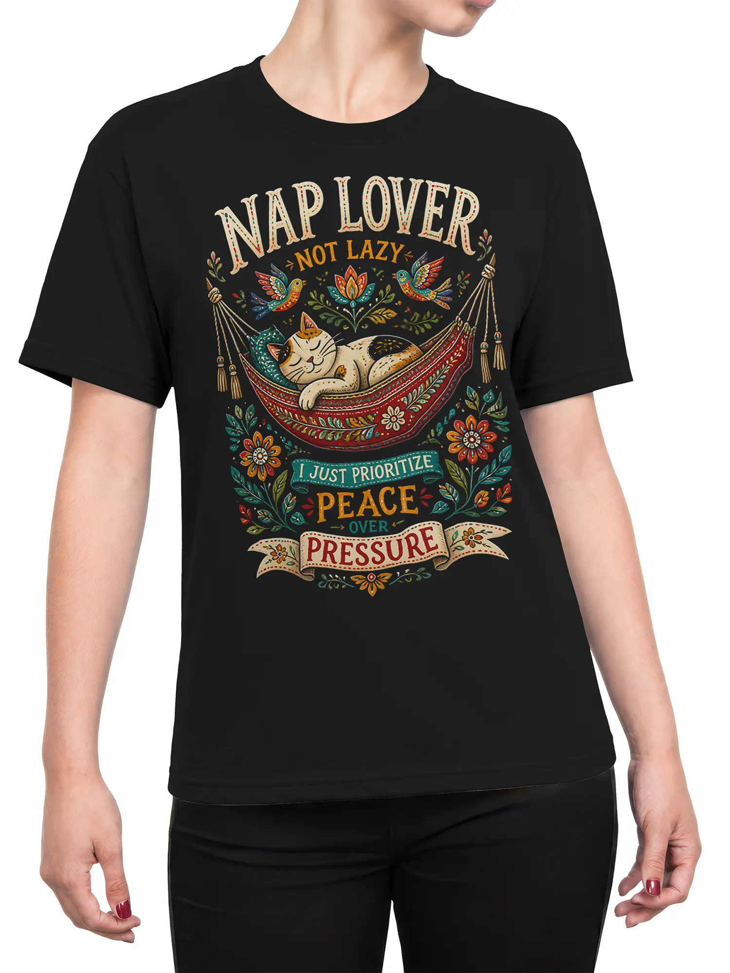Female torso wearing a black sleeping cat hammock T-shirt with colorful peace over pressure artwork