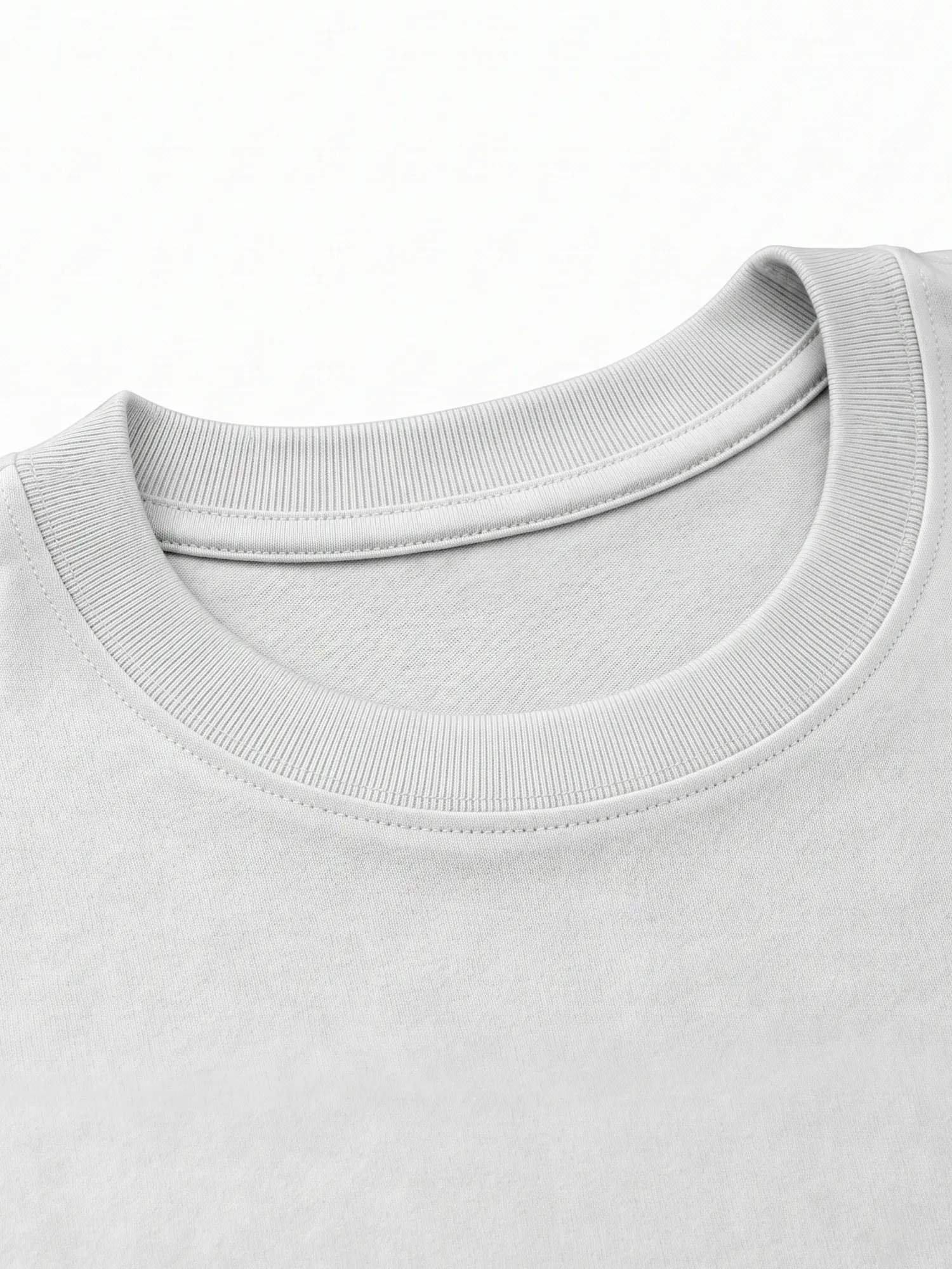 White cotton shirt collar and upper fabric shown in a clean close-up