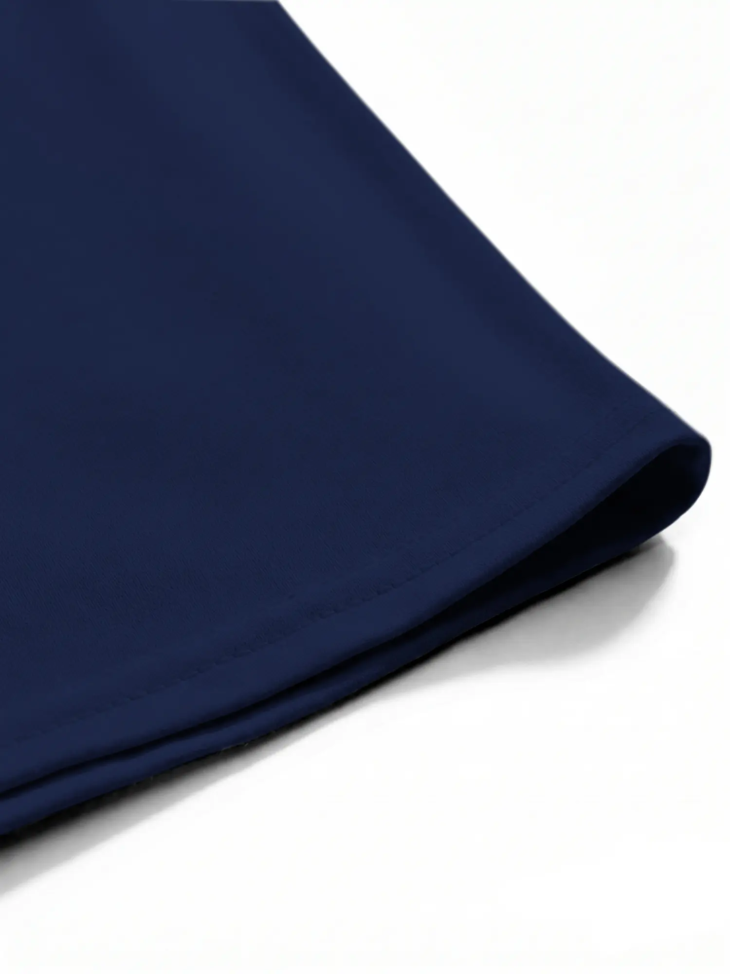 Navy cotton T-shirt hem and stitching shown in a detailed close-up view