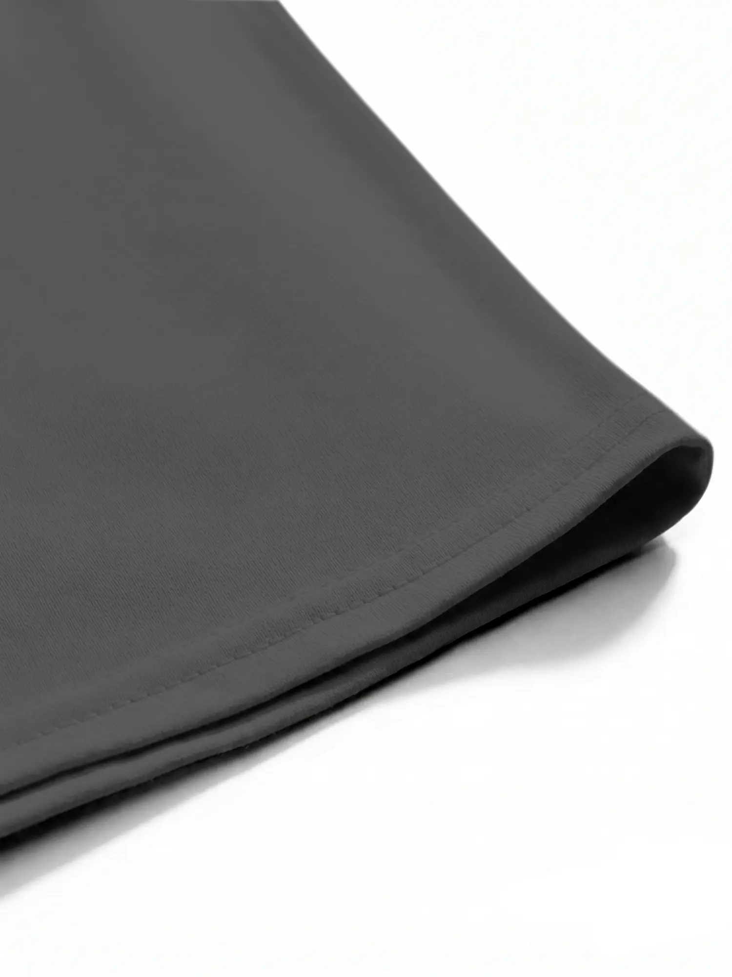 Close-up of gray cotton T-shirt hem and stitching with neat finishing details