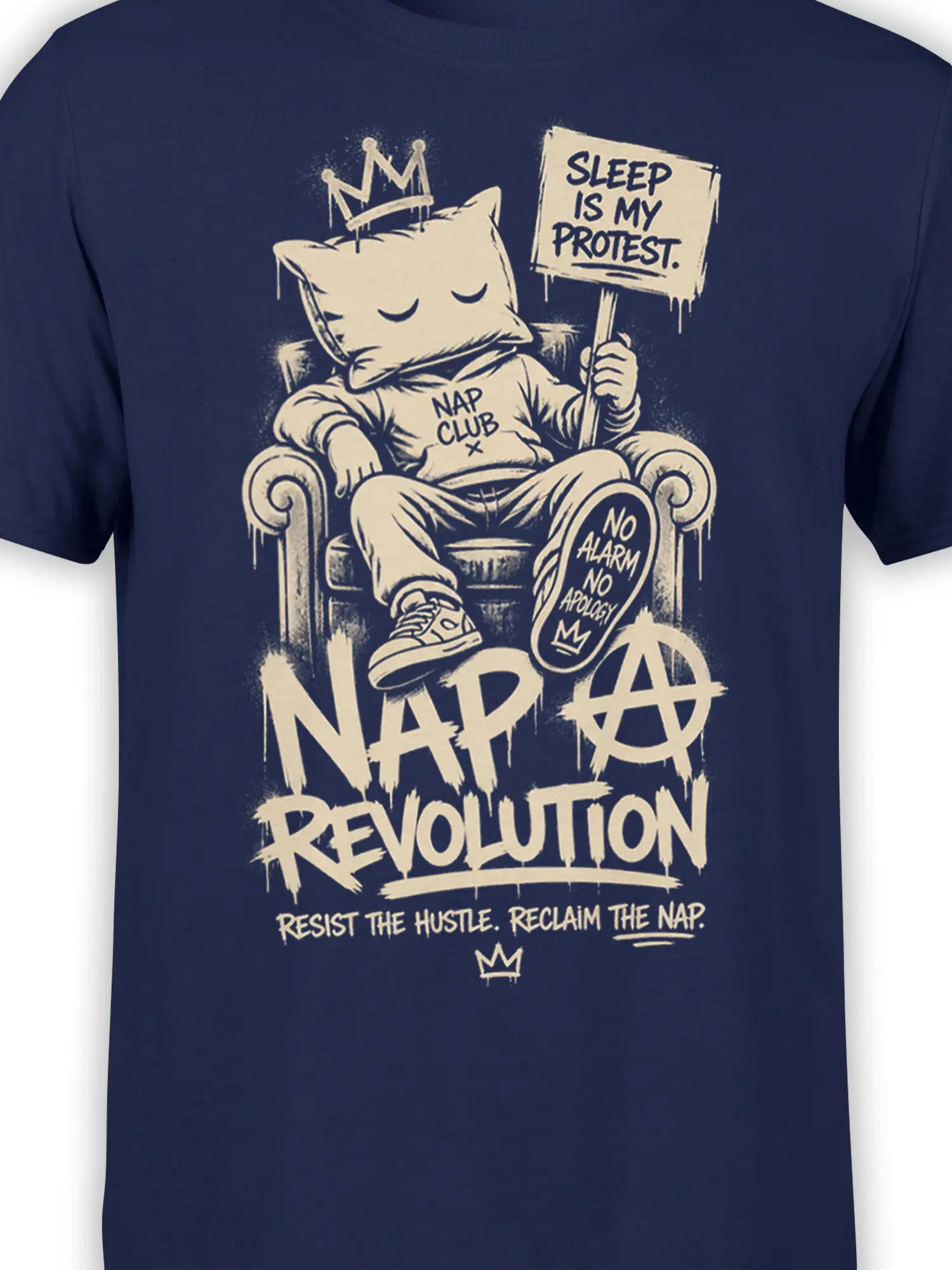 Close-up of the crowned sleeping cat and Nap Revolution protest artwork on a navy shirt
