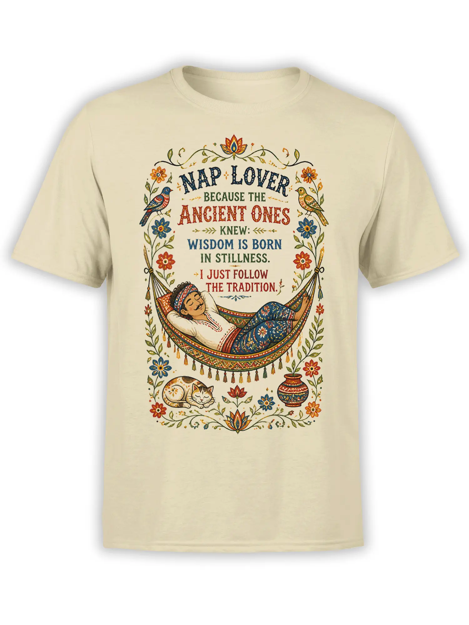 Beige cat T-shirt with a vintage folk-art hammock scene, sleeping figure, birds, flowers, and a nap wisdom quote