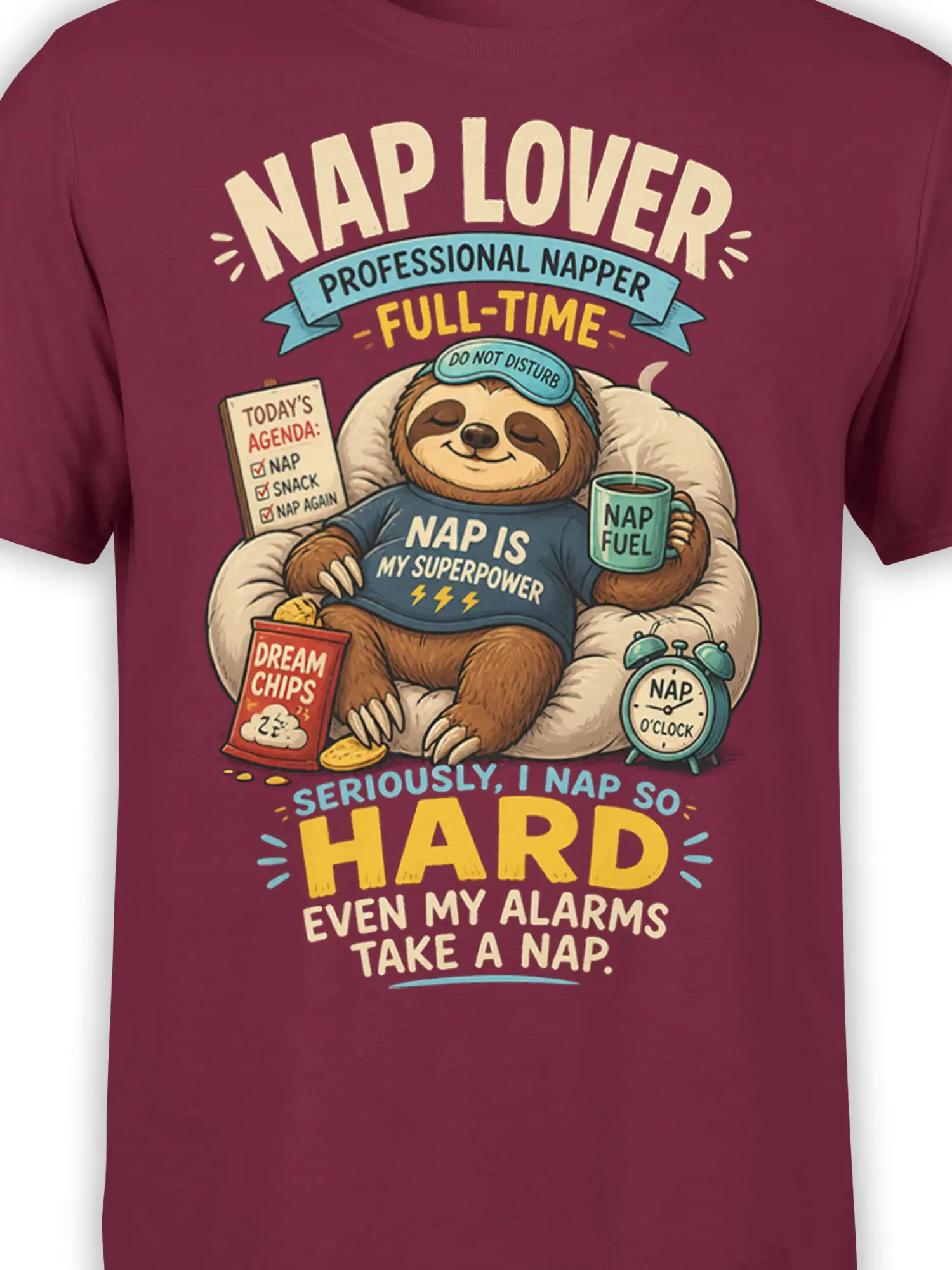 Close-up of sleepy sloth artwork with NAP IS MY SUPERPOWER text on a burgundy graphic tee