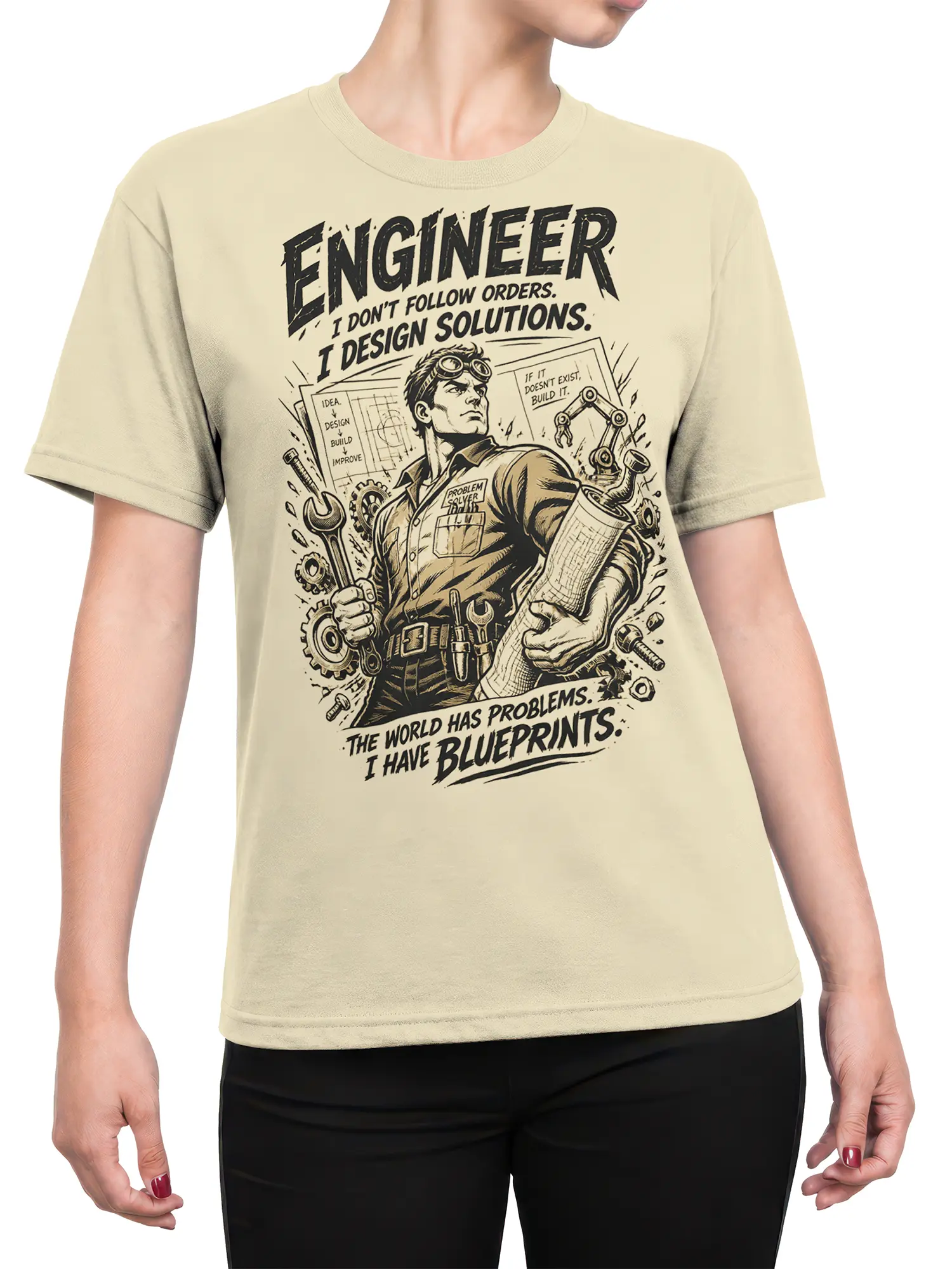 Female torso wearing a beige engineer t-shirt with goggles, tools, gears, blueprints, and problem-solver artwork