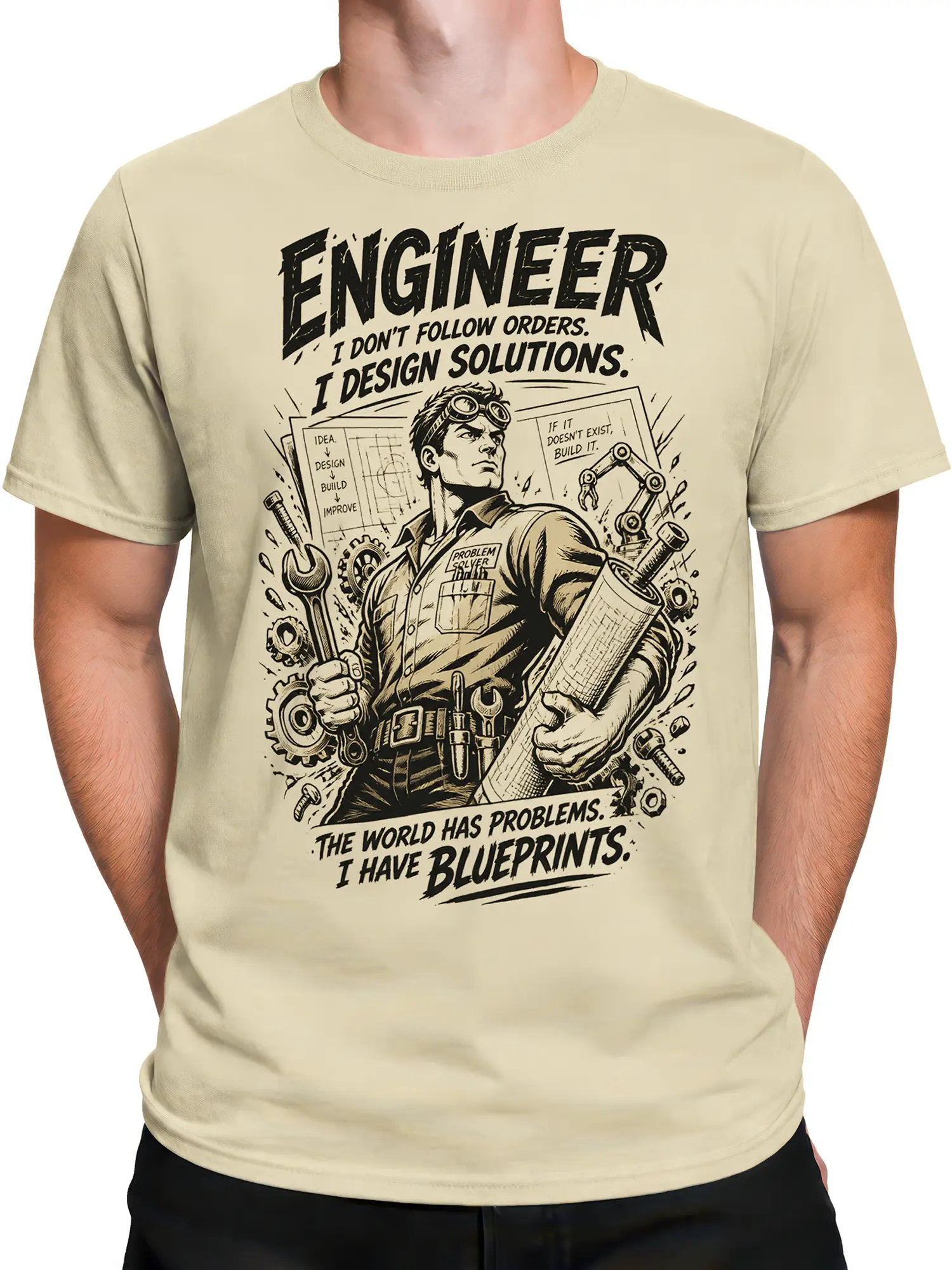 Male torso wearing a beige engineer t-shirt with mechanical gears, wrench, blueprints, and vintage graphic artwork