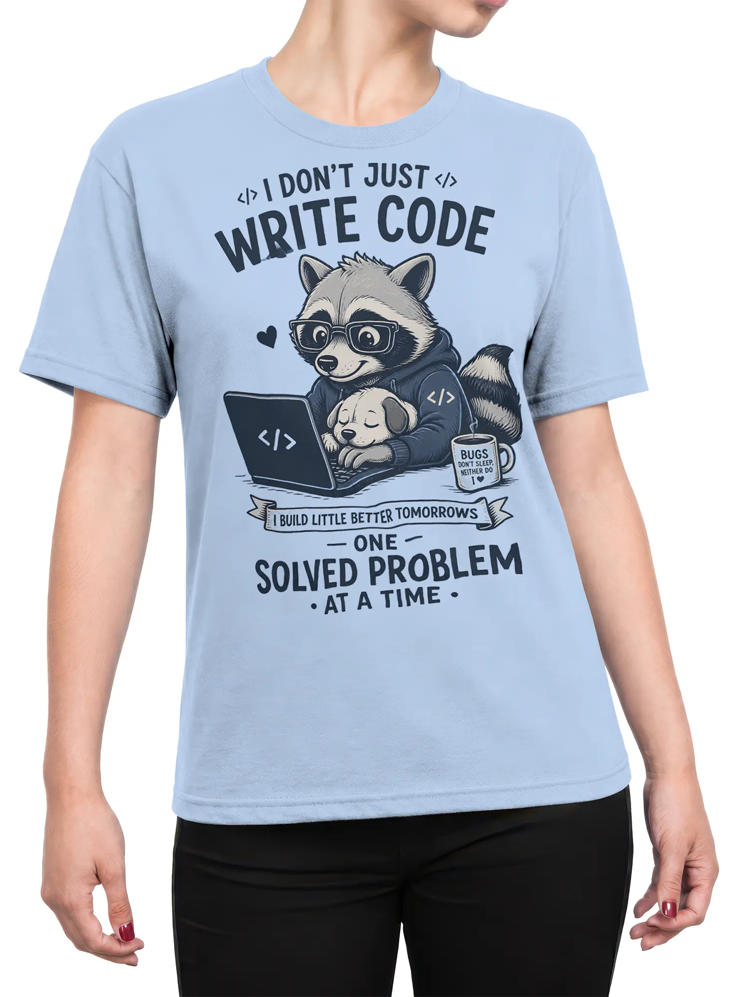 Female torso wearing a light blue raccoon programmer graphic T-shirt with a laptop, puppy, and coding message