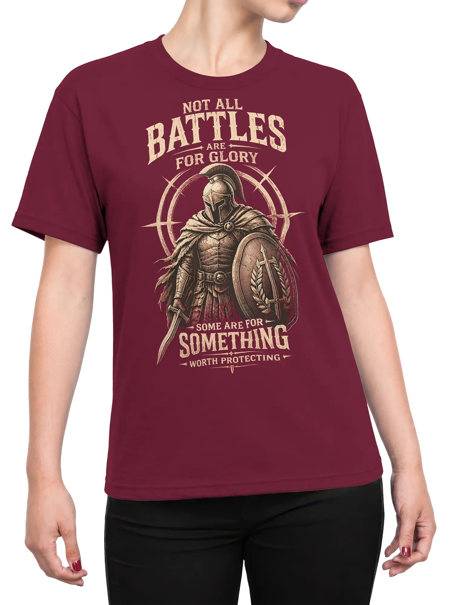 Female torso wearing a burgundy Roman warrior T-shirt with shield, sword, and vintage cream artwork