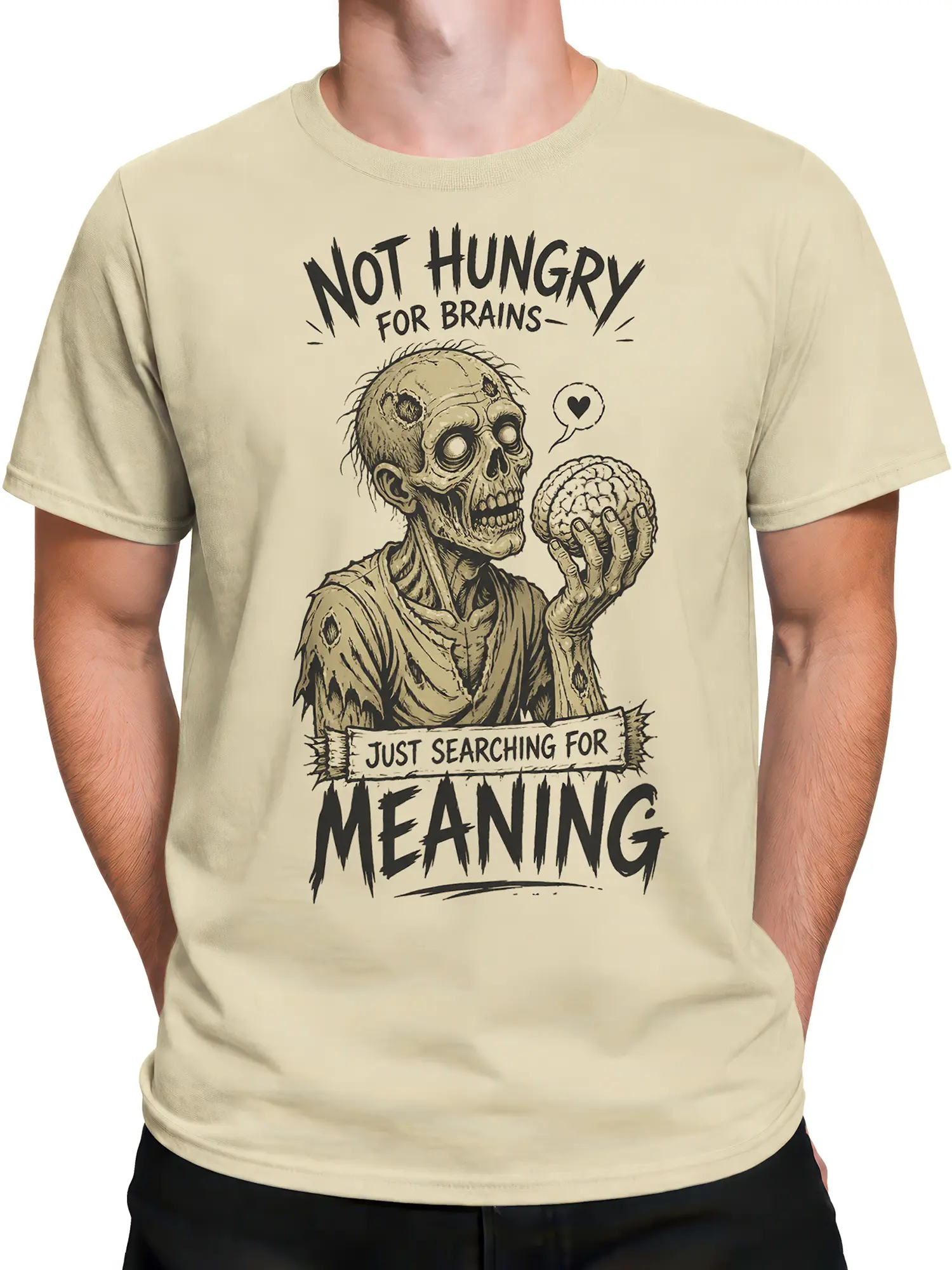 Male torso wearing a beige zombie T-shirt with a distressed brain graphic and meaning slogan
