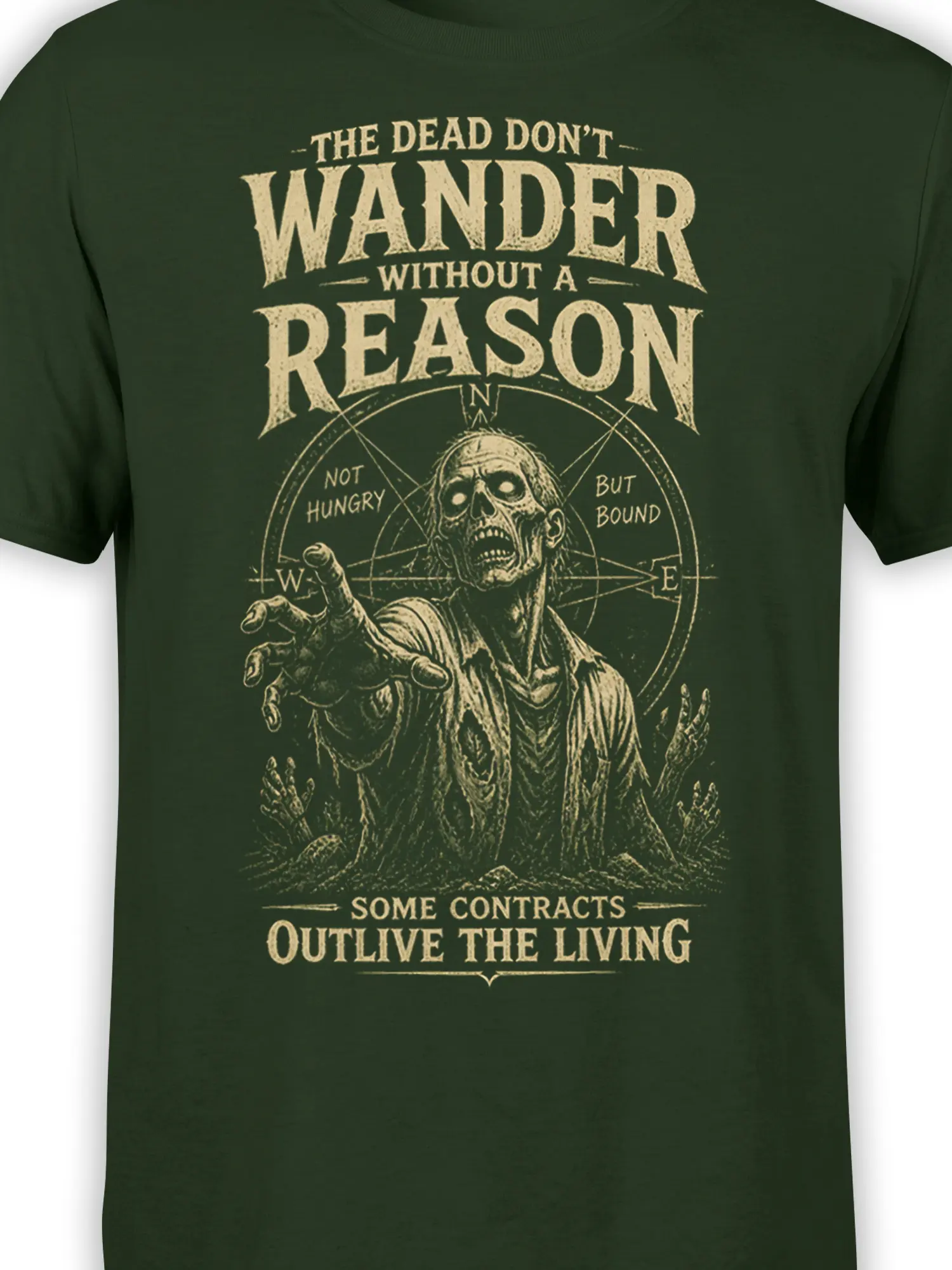 Close-up of distressed zombie artwork and compass lettering on a green T-shirt