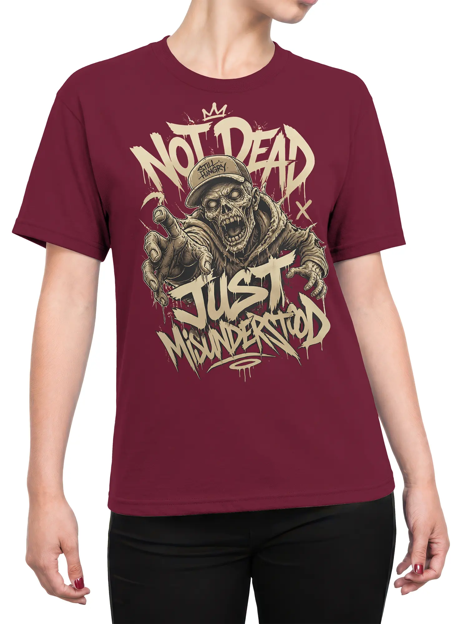 Female torso wearing a burgundy T-shirt with a crowned zombie and “Not Dead, Just Misunderstood” design