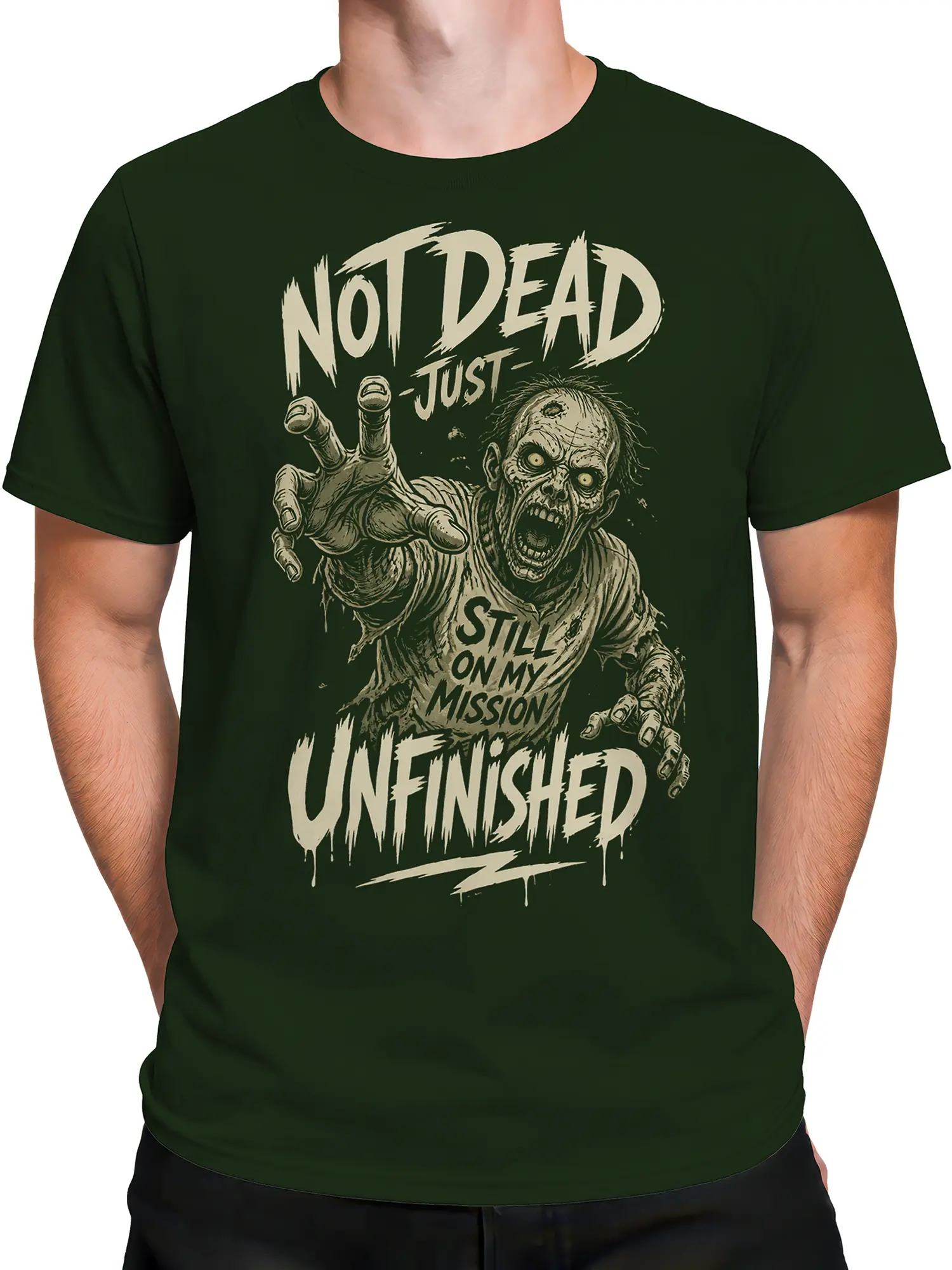 Male torso wearing a dark green zombie T-shirt with distressed horror artwork and mission lettering