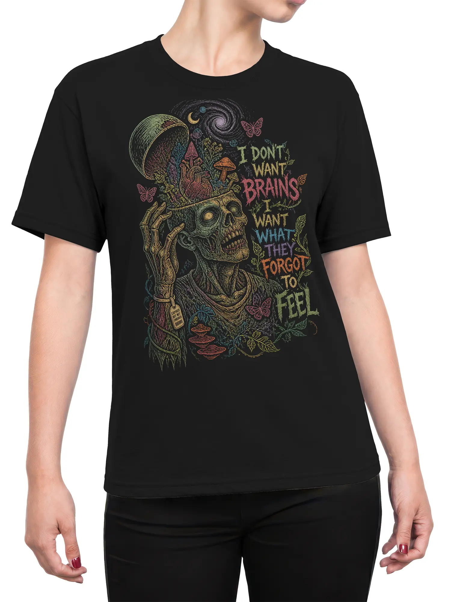 Female torso wearing a black zombie T-shirt with colorful bones, mushrooms, butterflies, and forgotten feelings artwork