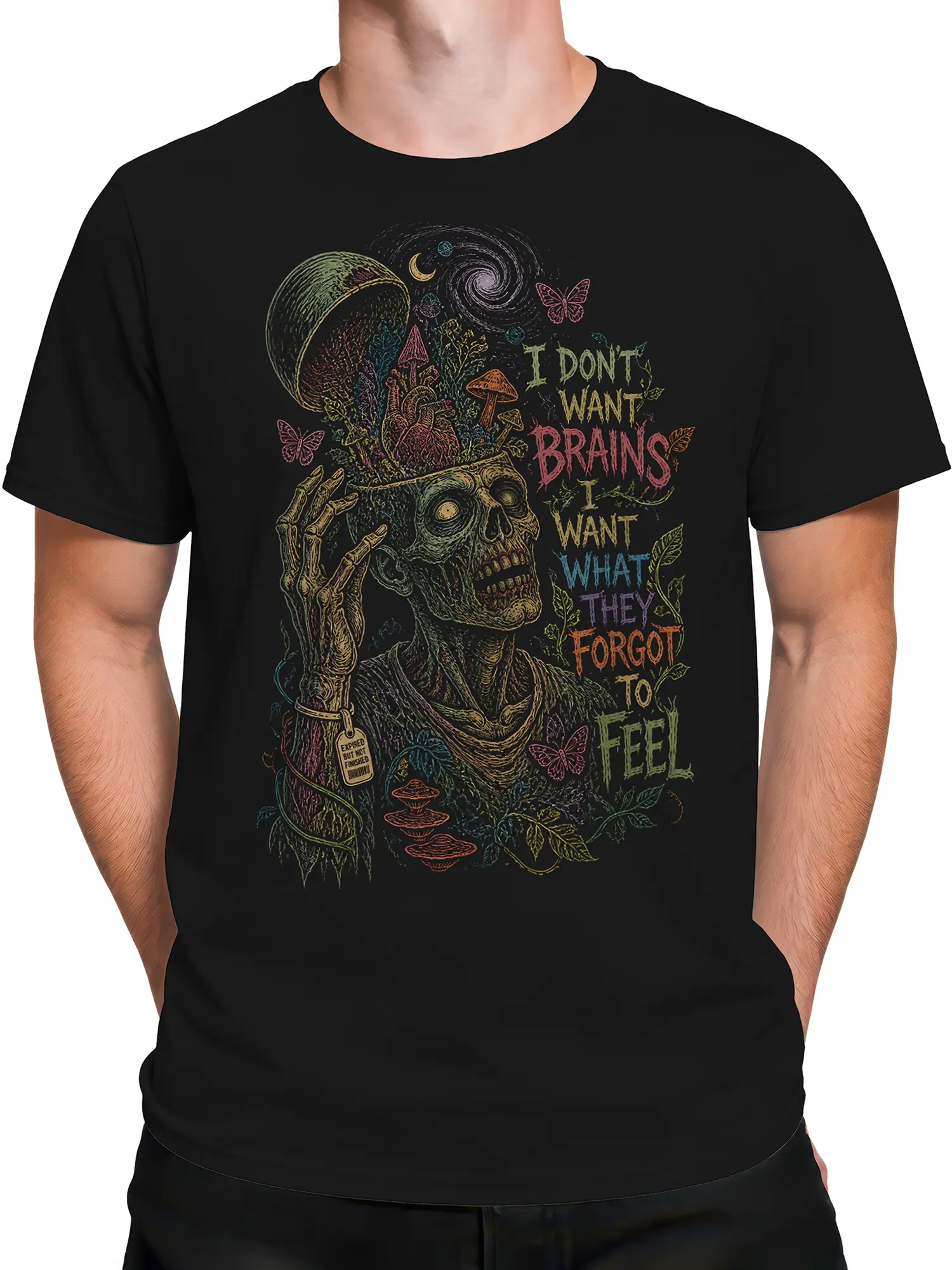 Male torso wearing a black zombie T-shirt with a colorful undead figure and emotional forgotten feelings design