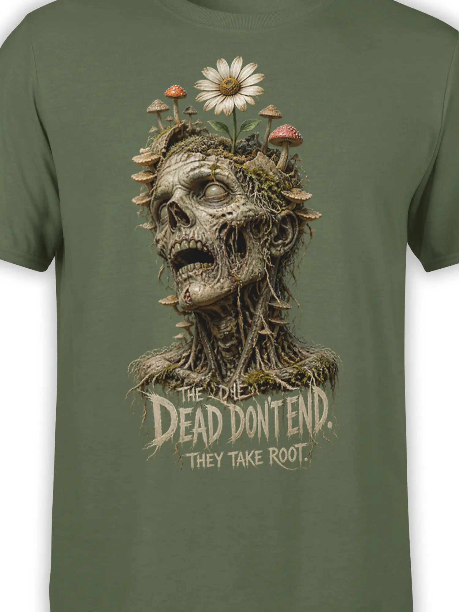 Close-up of the rooted skull, mushrooms, daisy, and distressed text on a green T-shirt