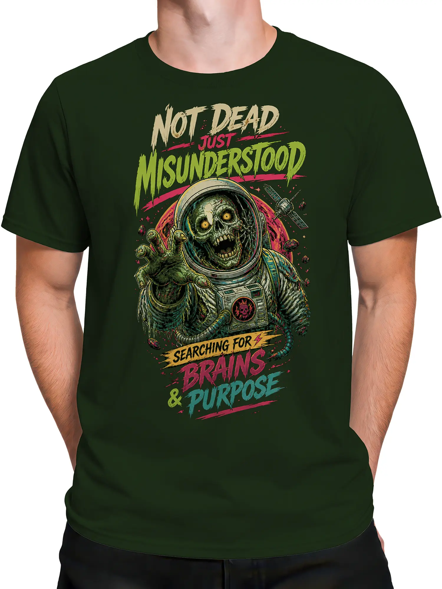 Male torso wearing a green zombie astronaut T-shirt with skull space art and colorful graphic lettering