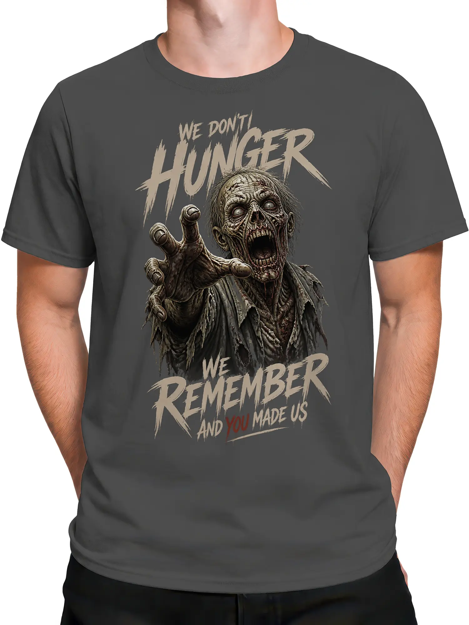 Male torso wearing a gray zombie graphic tee with undead artwork and “We Remember” lettering