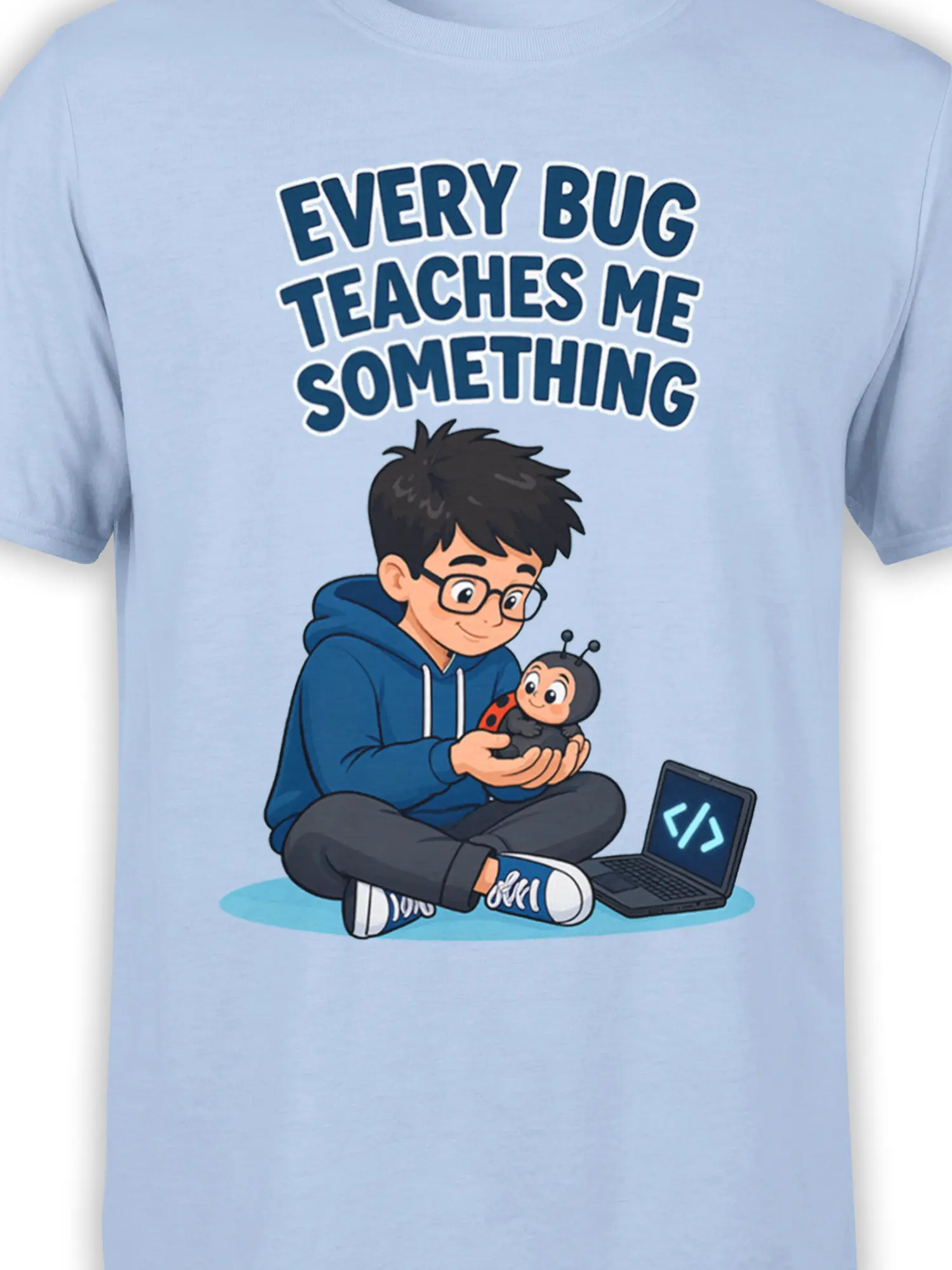Close-up of the young coder, ladybug, laptop, and bold lettering on the light blue programmer T-shirt