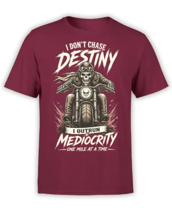 Skull-faced biker riding a motorcycle on a burgundy T-shirt with an anti-mediocrity slogan