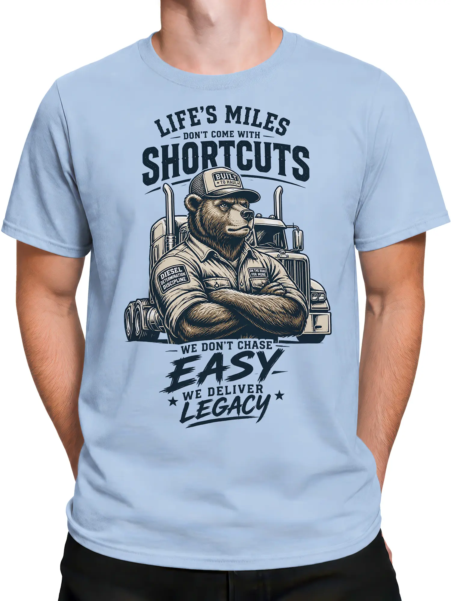 Male torso wearing a light blue bear trucker T-shirt with rugged semi truck artwork
