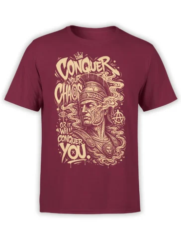 Burgundy warrior T-shirt with cream vintage artwork, flowing hair, symbols, and bold Conquer Your Chaos lettering