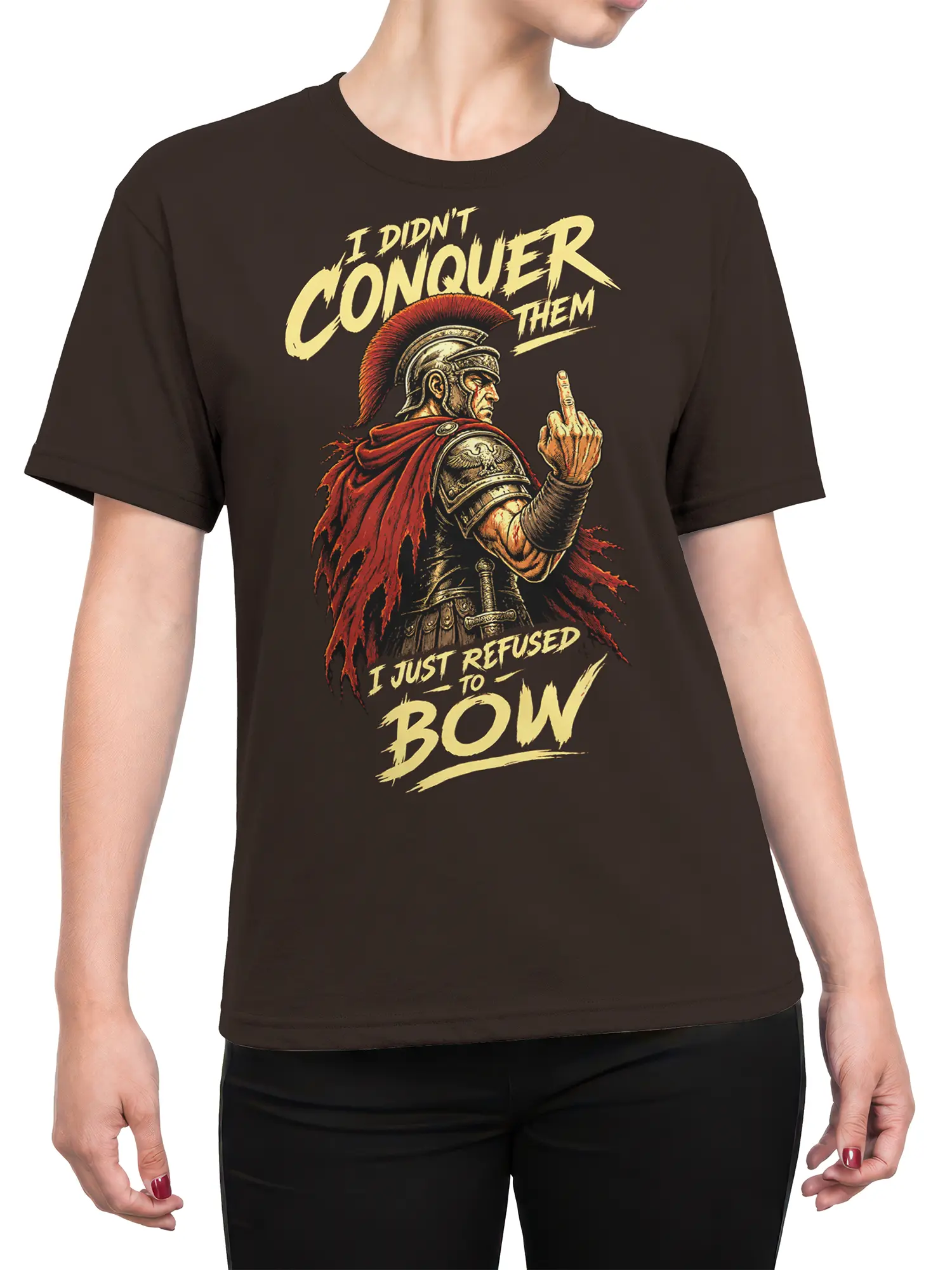 Female torso wearing a brown Roman warrior T-shirt with red cape artwork and bold rebellious cream lettering