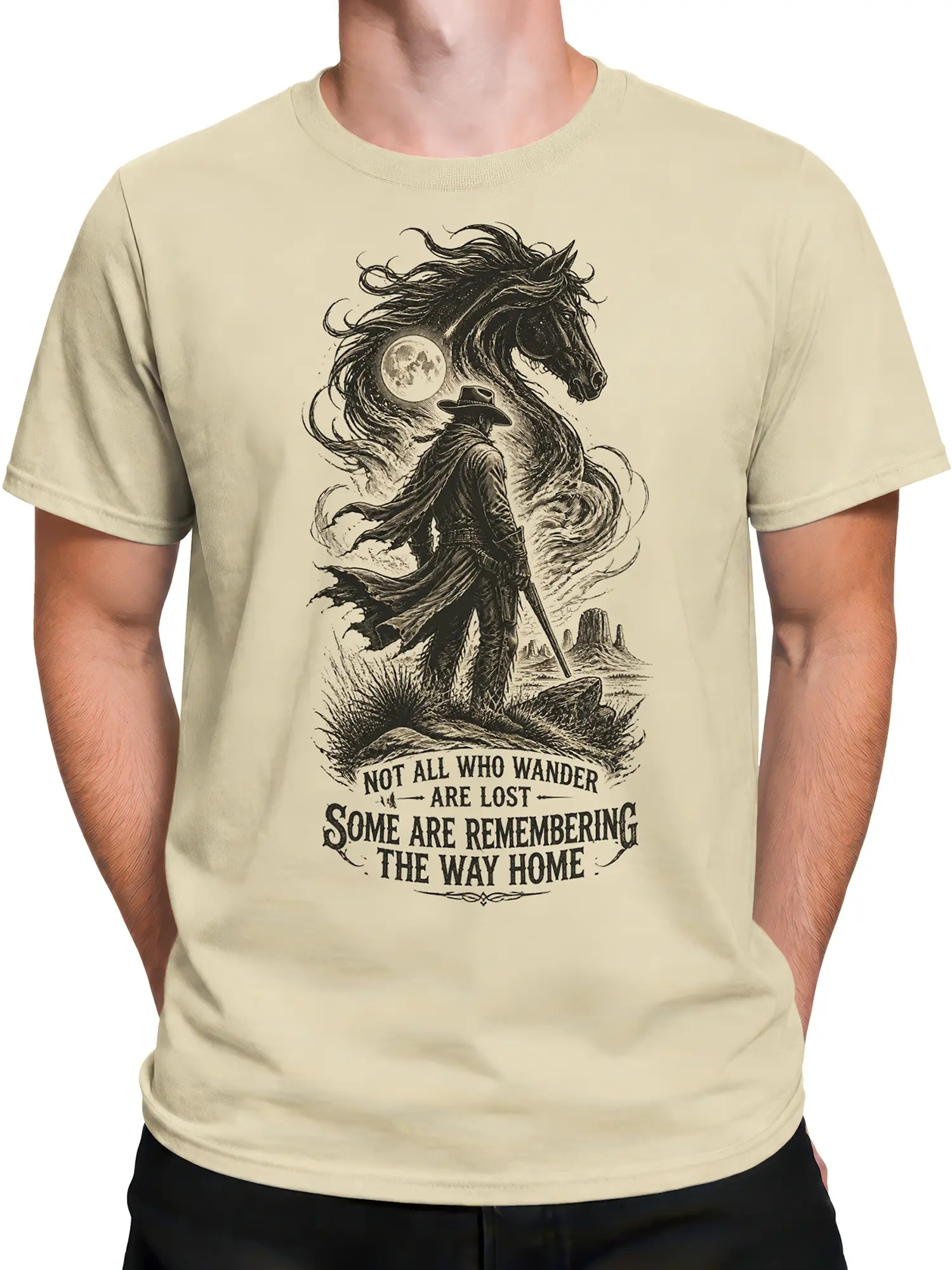 Male torso wearing a beige western shirt with a cowboy, horse, and moon graphic