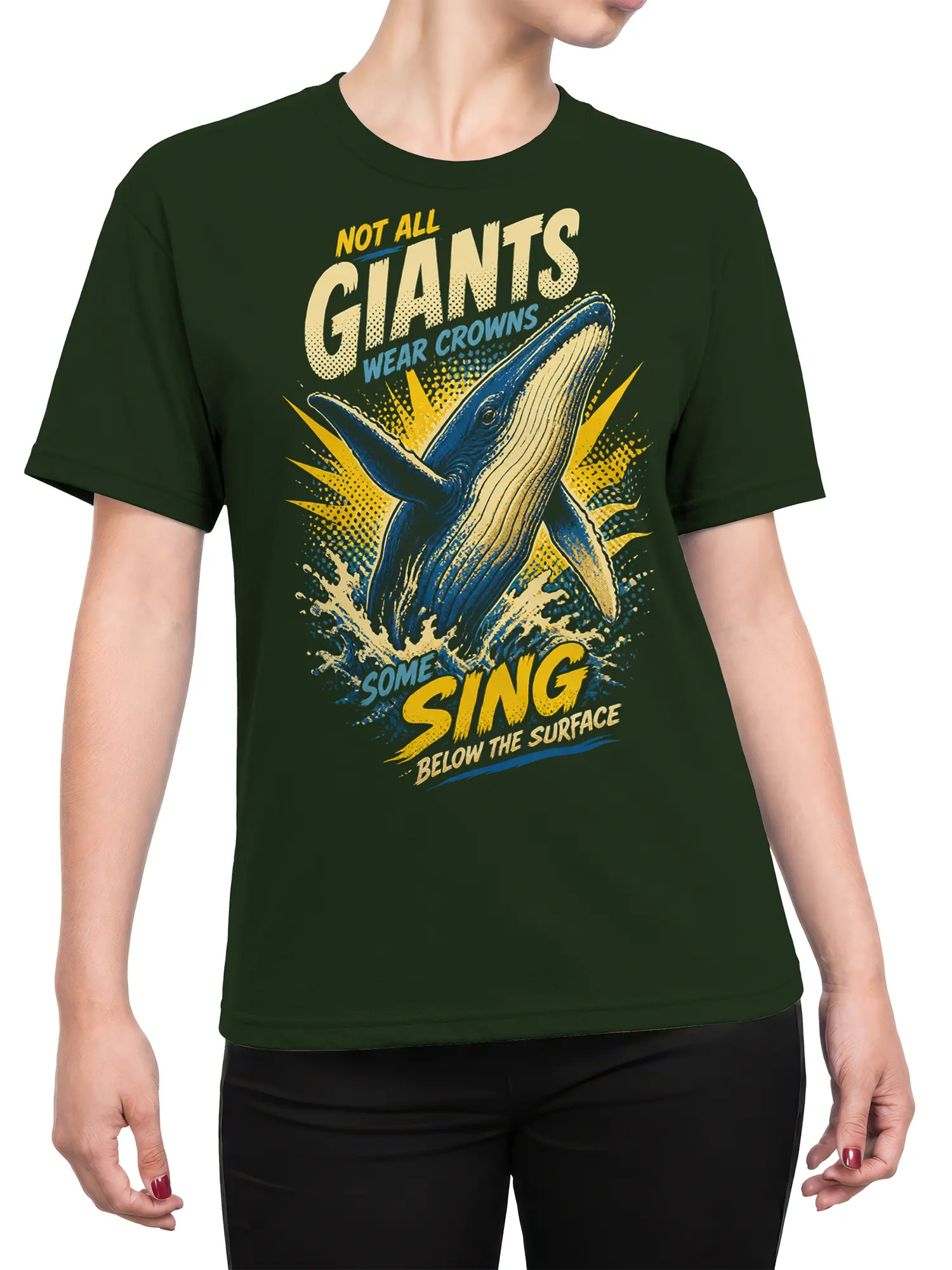 Female torso wearing a dark green whale T-shirt with bold retro ocean artwork and blue, yellow, and cream details