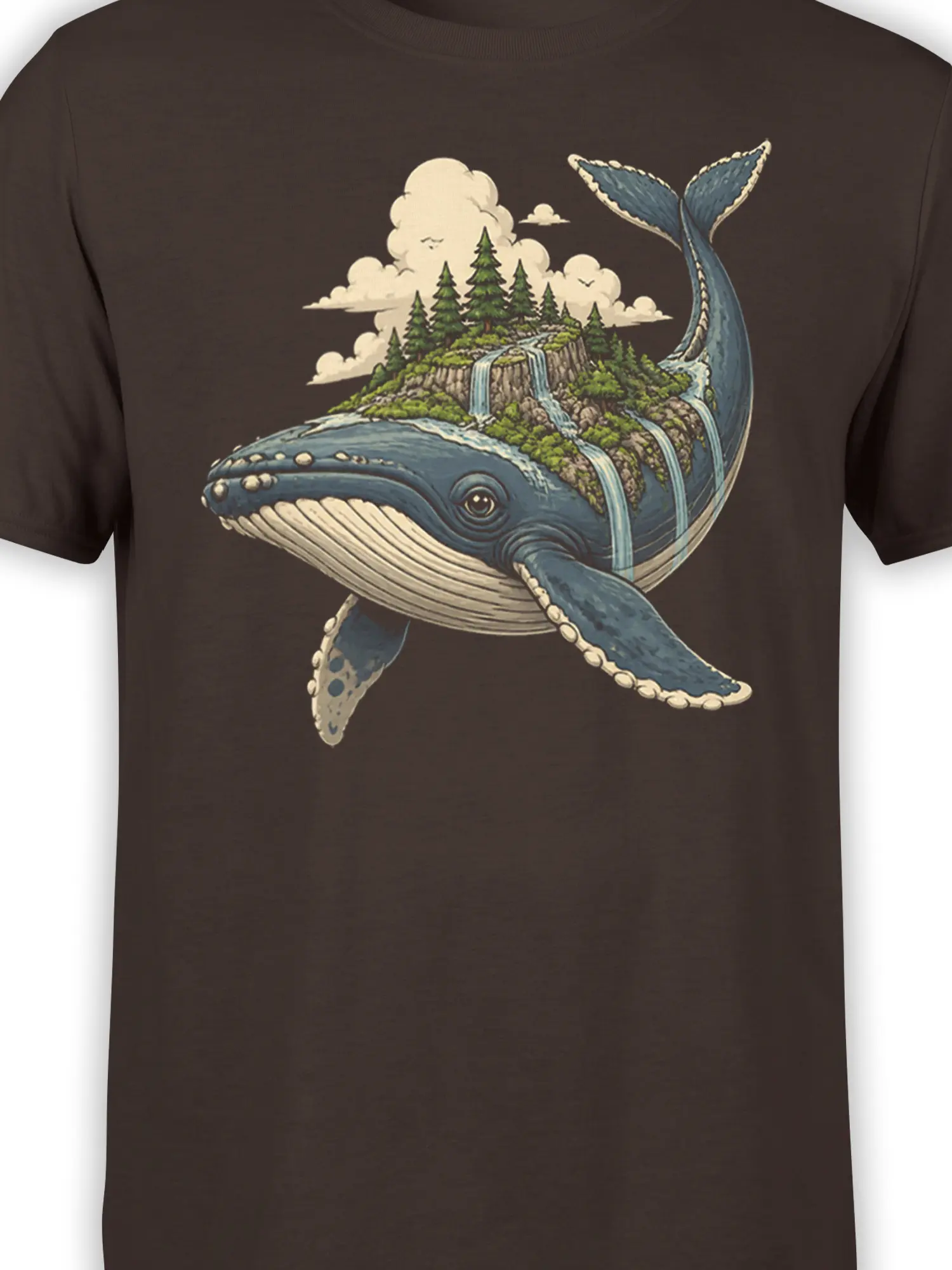 Close-up of blue whale and forest island artwork with waterfalls on a brown graphic tee