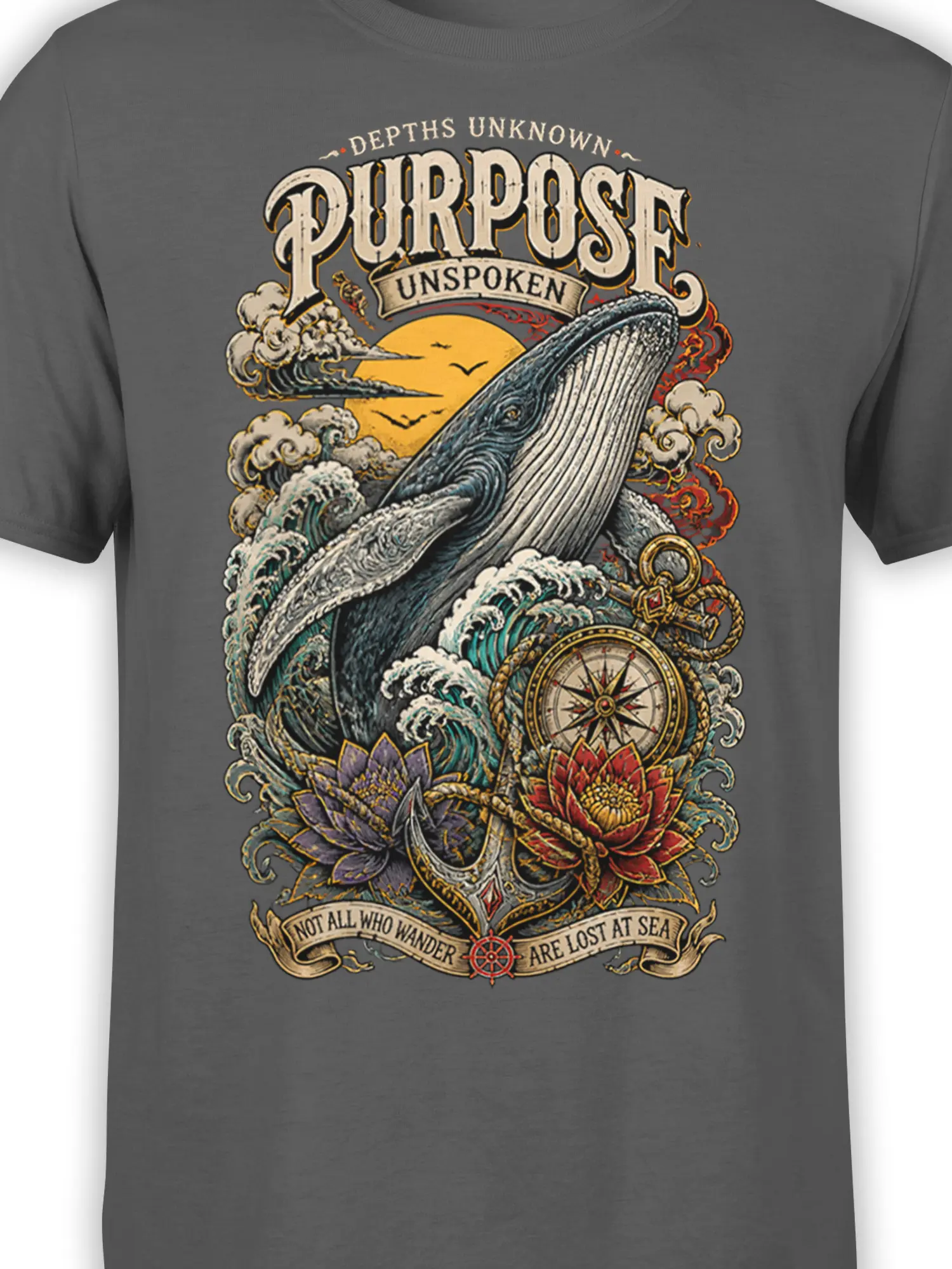 Close-up of whale compass artwork on a dark gray shirt with vintage maritime details and ocean waves