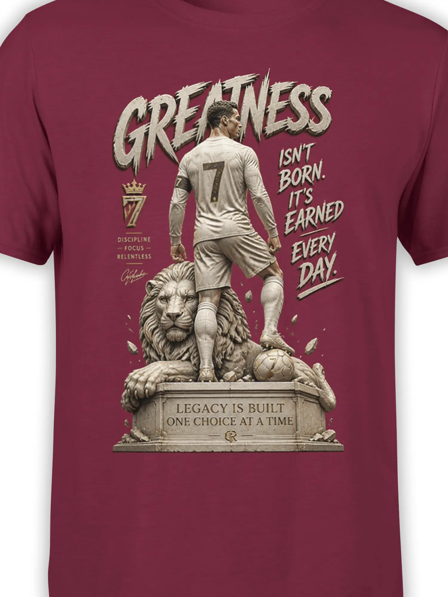 Close-up of number 7 soccer player and lion artwork with greatness lettering on a burgundy shirt