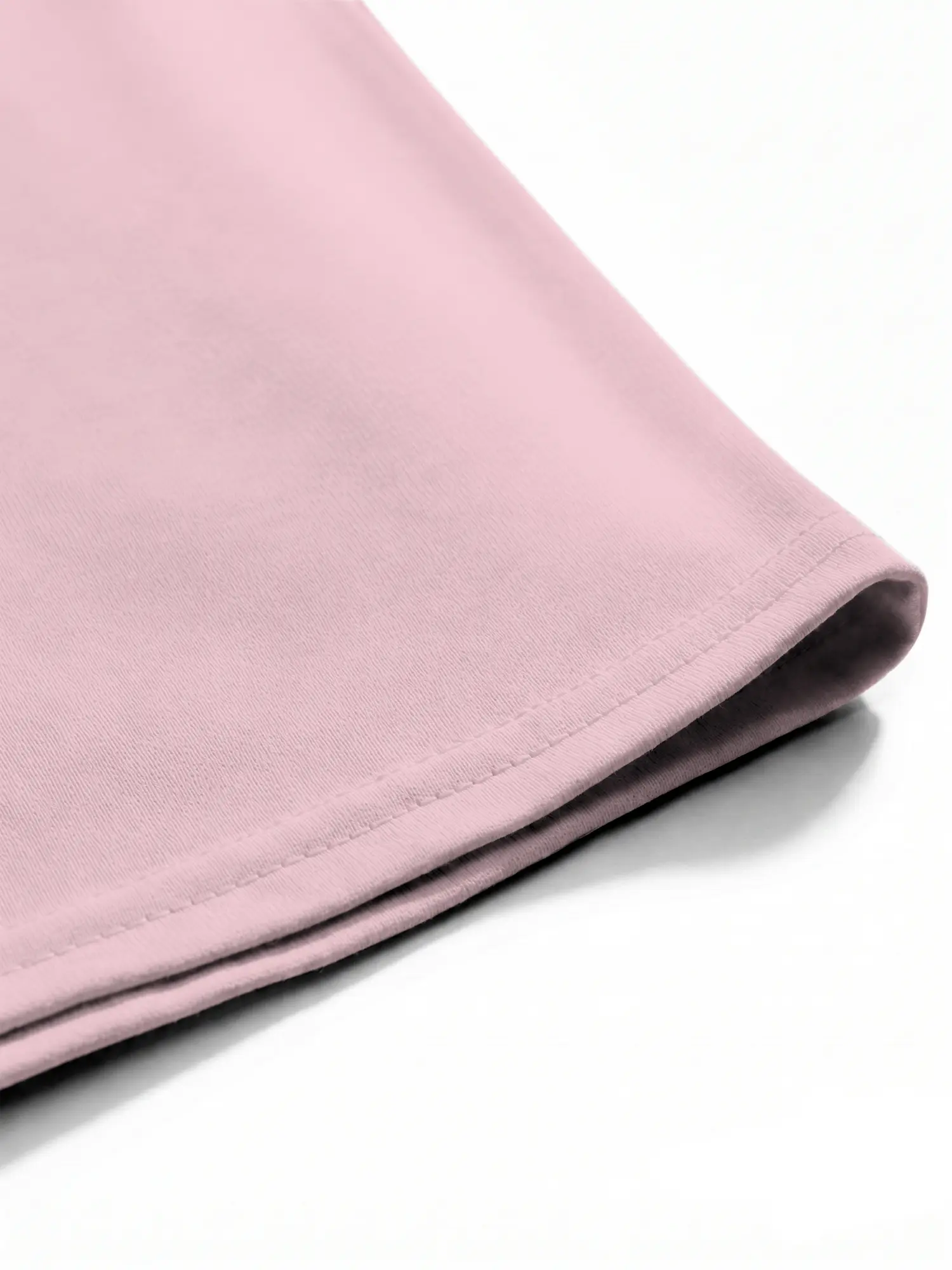 Pink cotton T-shirt hem with neat stitching and smooth fabric finish