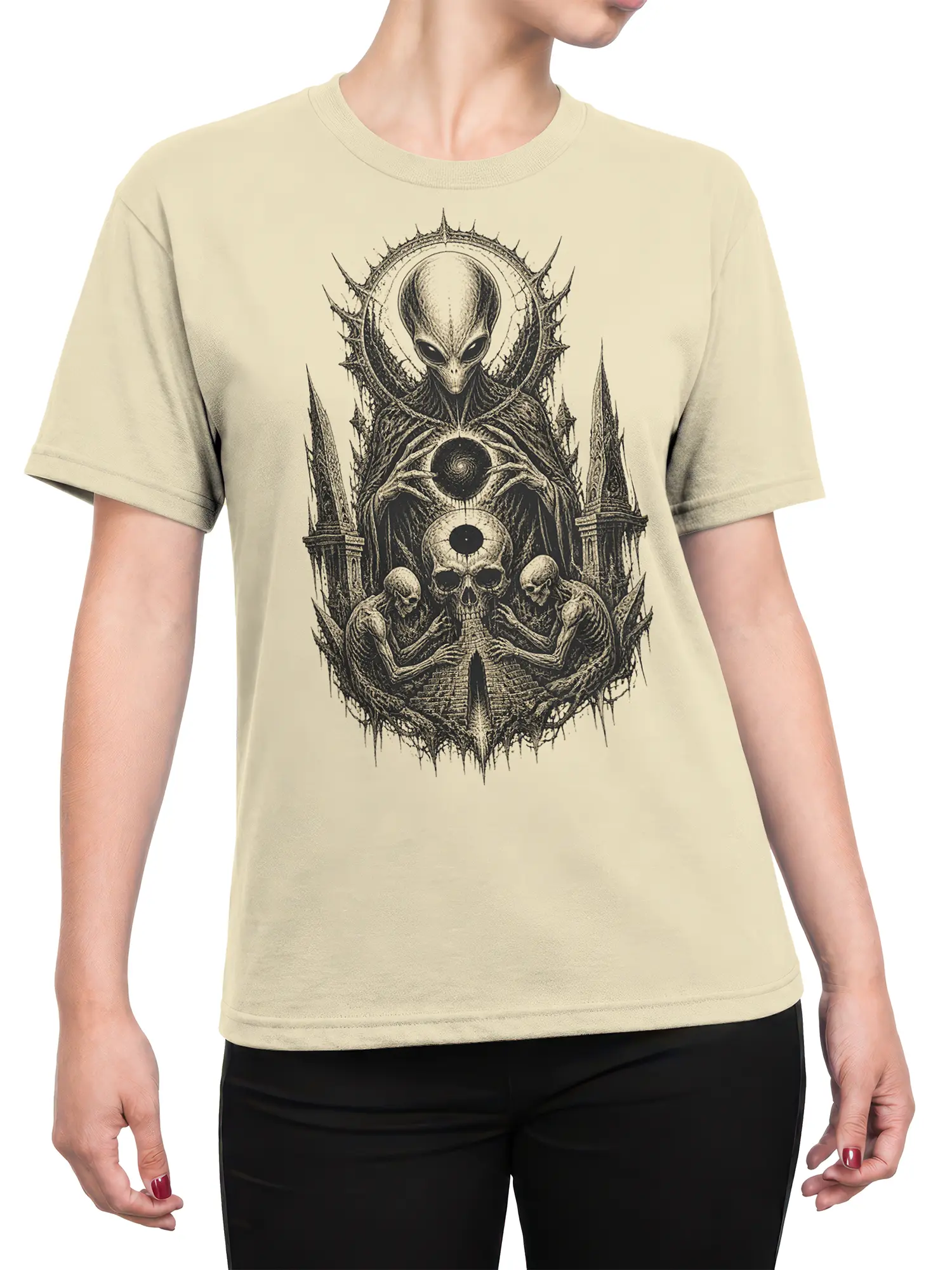 Female torso wearing a beige alien graphic tee with gothic skulls, skeletons, spires, and a cosmic orb