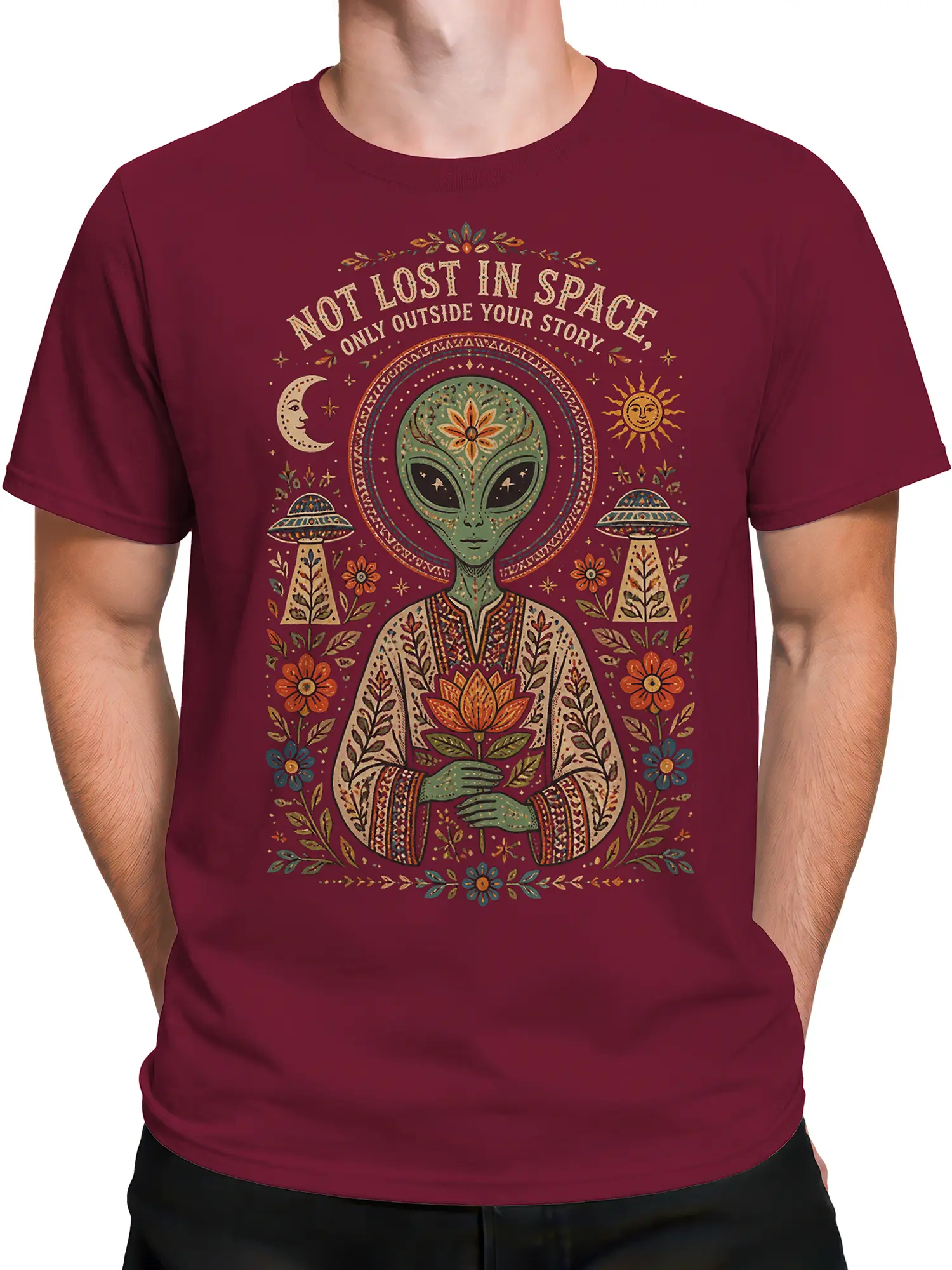 Male torso wearing a maroon alien T-shirt with an ornate lotus, moon, sun, UFOs, flowers, and space quote