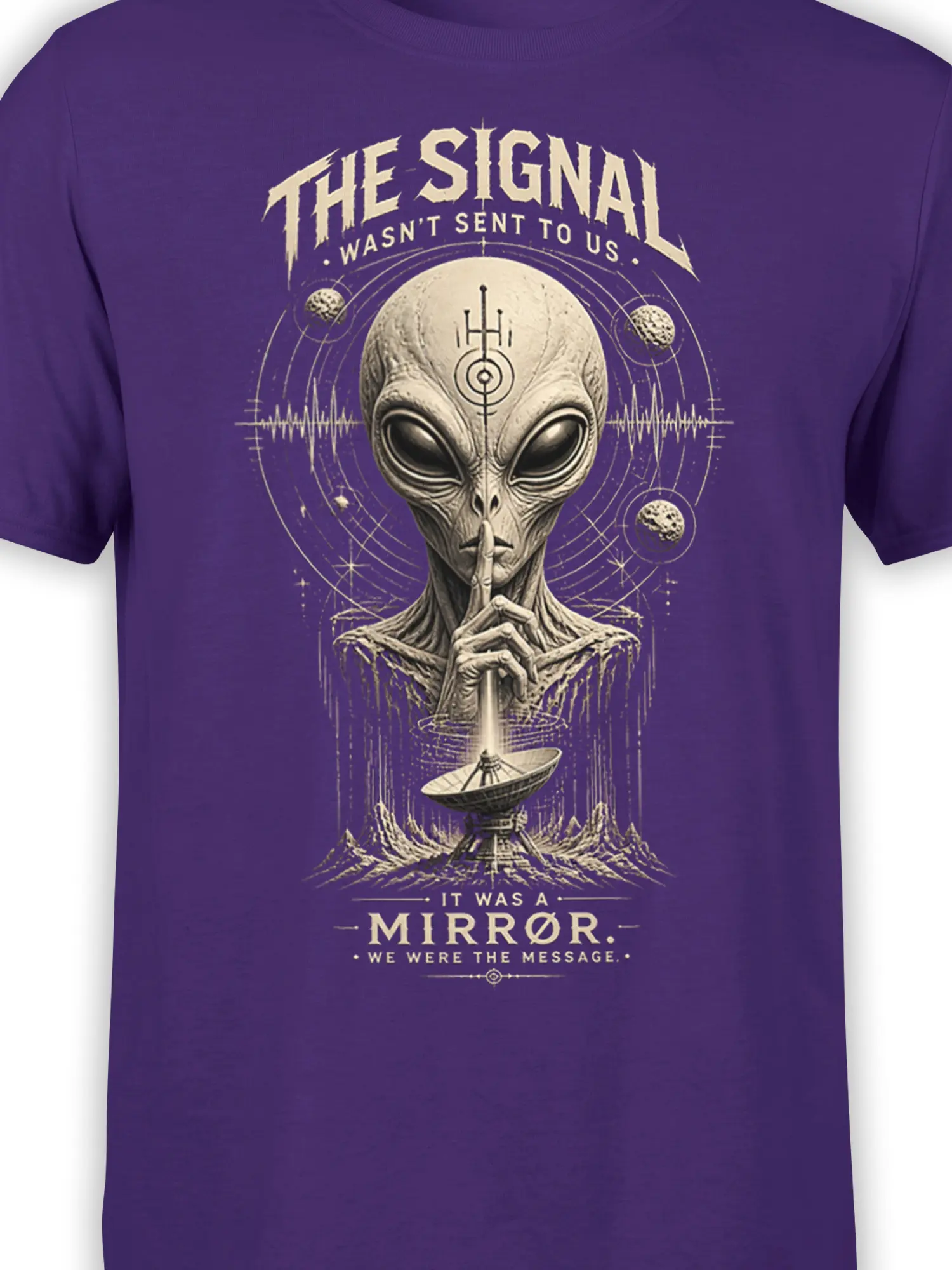Close-up of gray alien artwork and cosmic signal details on a purple sci-fi T-shirt