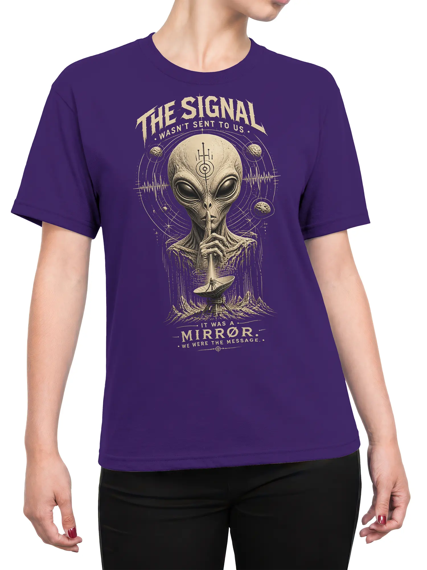 Female torso wearing a purple alien T-shirt with cosmic artwork and a mysterious signal message