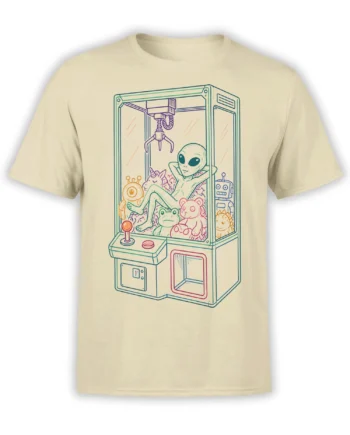 Beige alien claw machine T-shirt showing a relaxed green alien surrounded by a unicorn, frog, robot, and plush toys