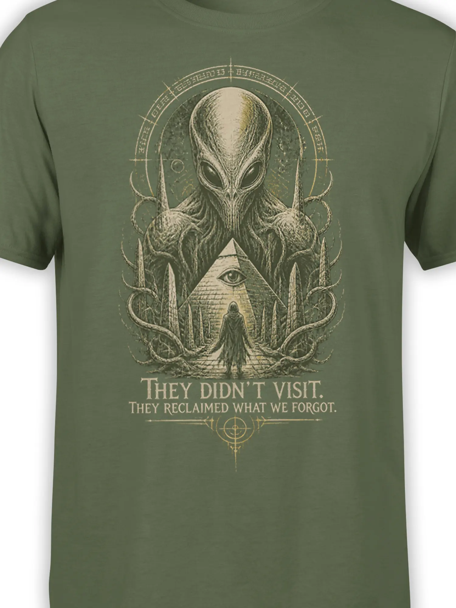 Close-up of olive green alien graphic tee showing the alien face, tentacles, pyramid eye, and cryptic symbols
