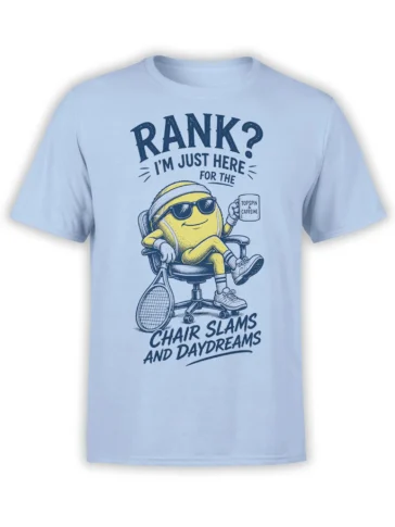 Light blue tennis T-shirt with yellow character, racket, coffee mug, and chair slams daydreams text