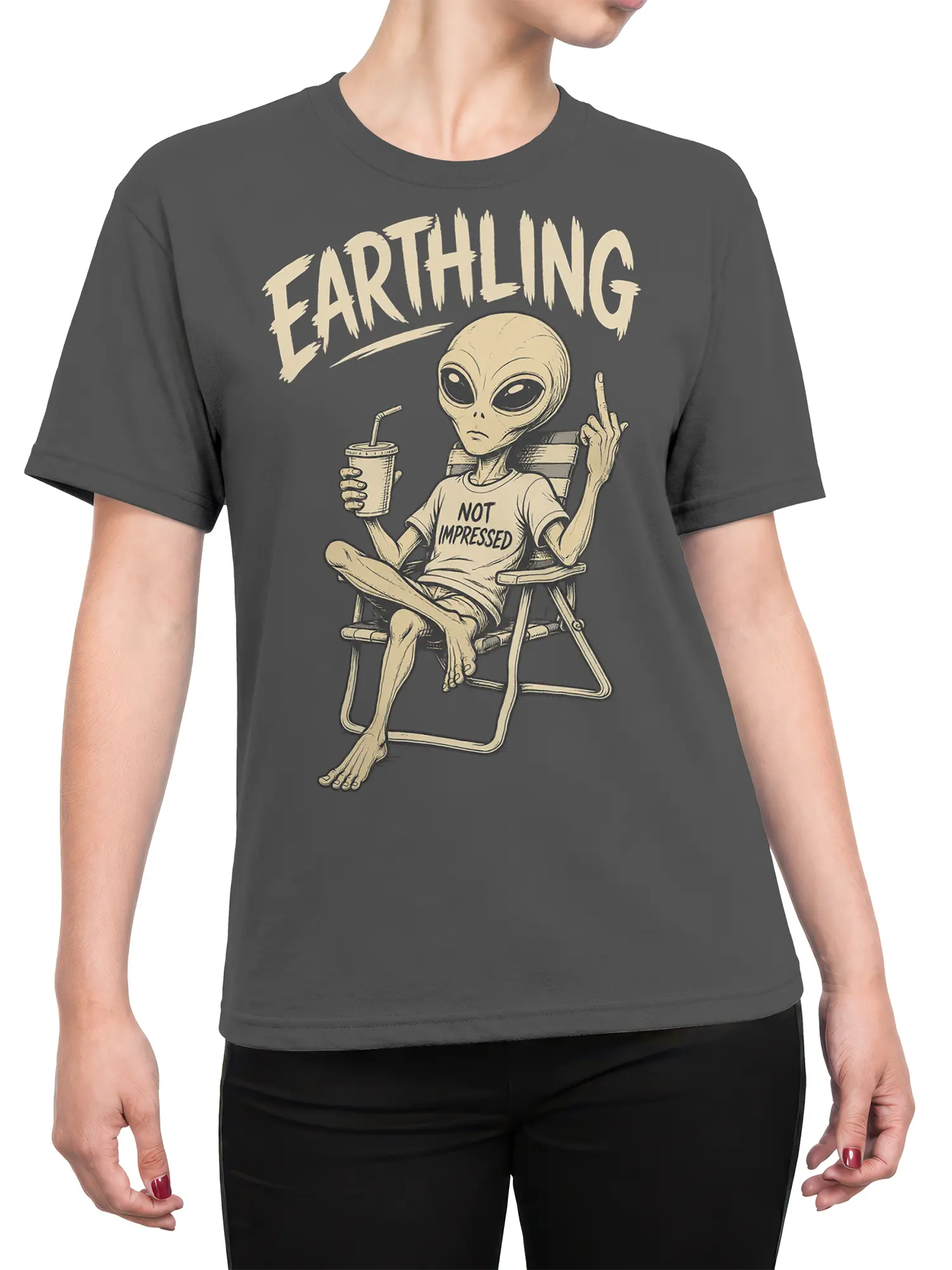 Female torso wearing a charcoal gray alien T-shirt with “FARTHLING” and “NOT IMPRESSED” artwork