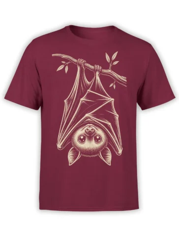 Upside-down bat hanging from a leafy branch on a burgundy T-shirt in cream line art