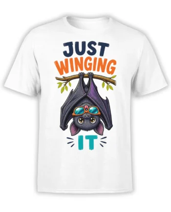 White bat T-shirt with an upside-down goggle-wearing bat, leafy branch, and “Just Winging It” lettering